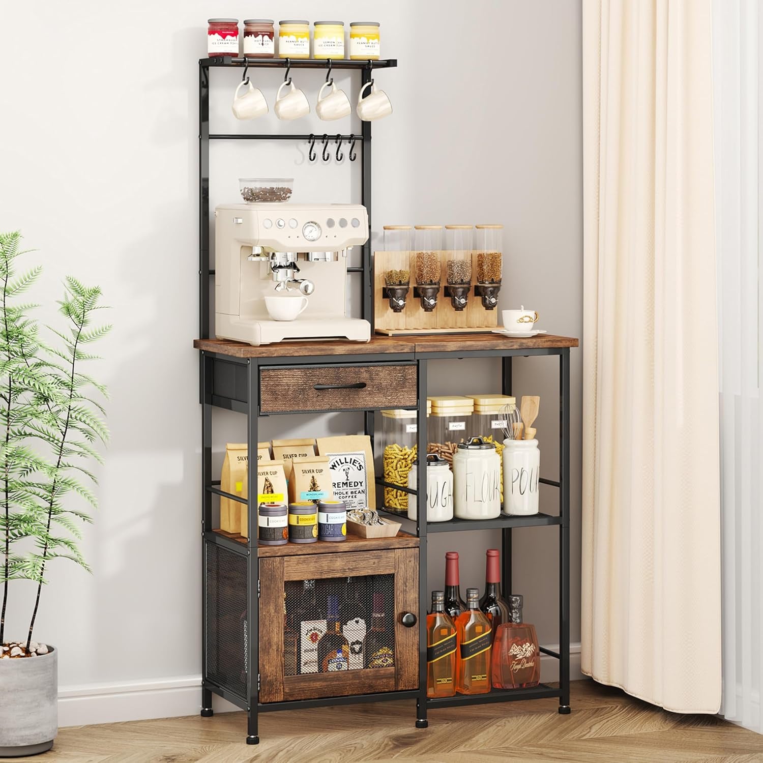 Tall sideboard with black frame and rustic wood drawer and door, topped with a coffee maker and dispensers