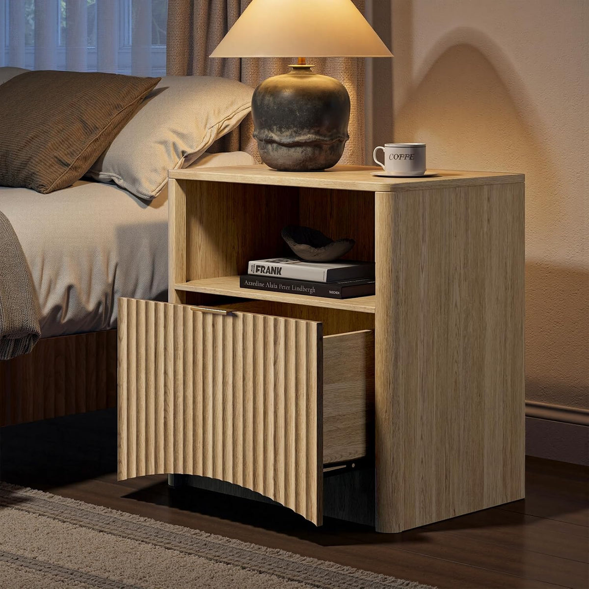 Close-up of a fluted nightstand in Natural Beech with an open shelf and a partially open drawer