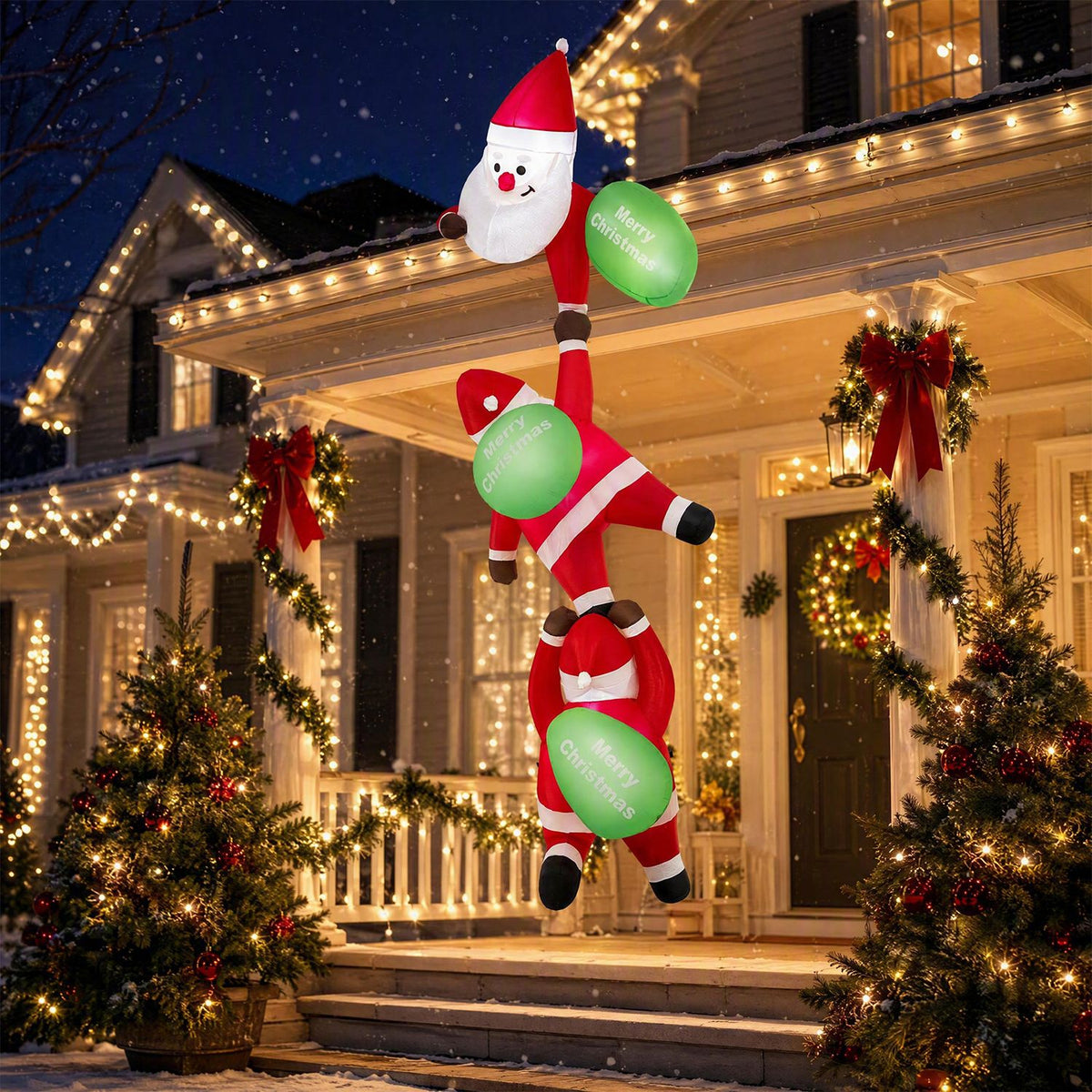 Three climbing Santa inflatable displayed outside a decorated home at night