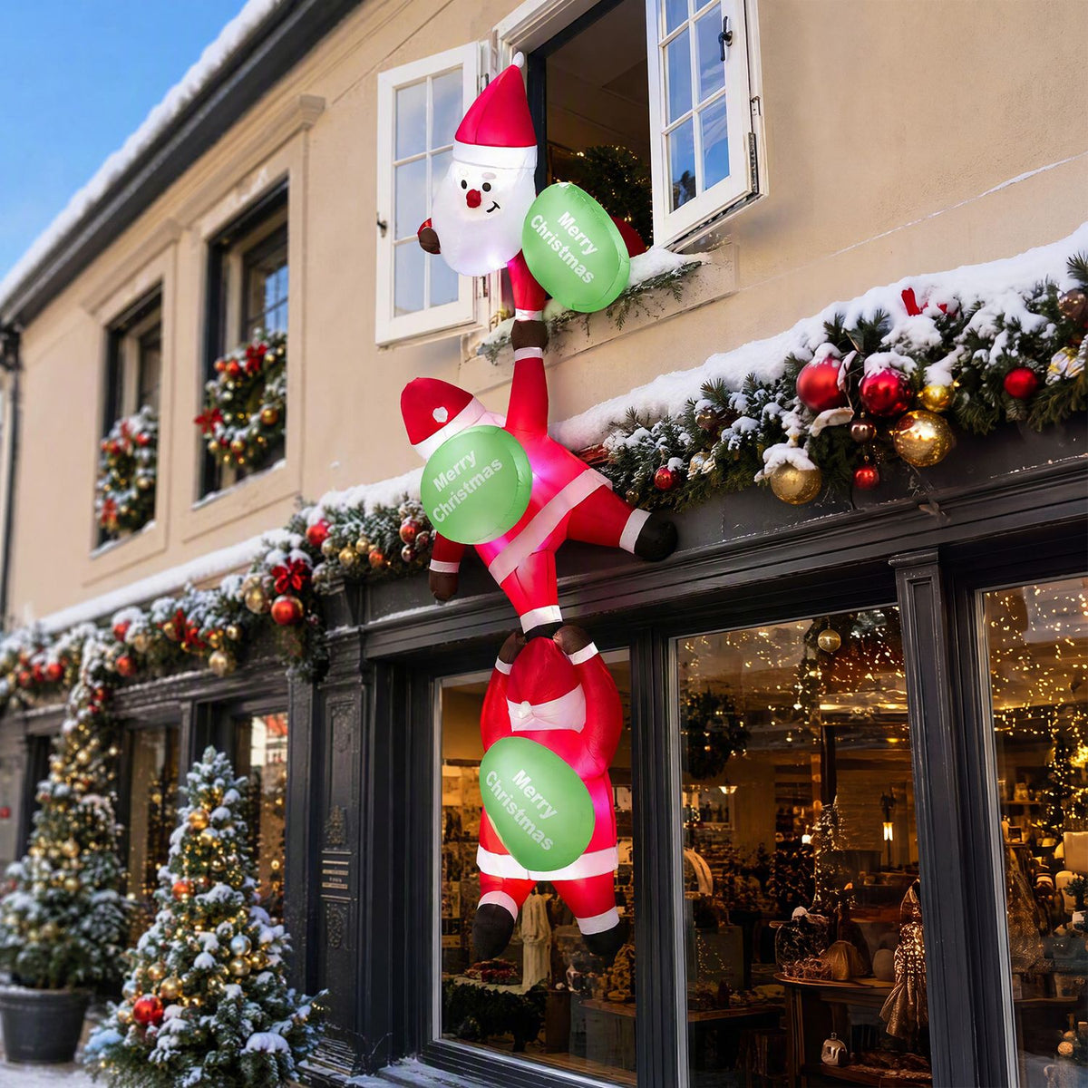 Red and green Santa inflatable hanging above a snowy storefront