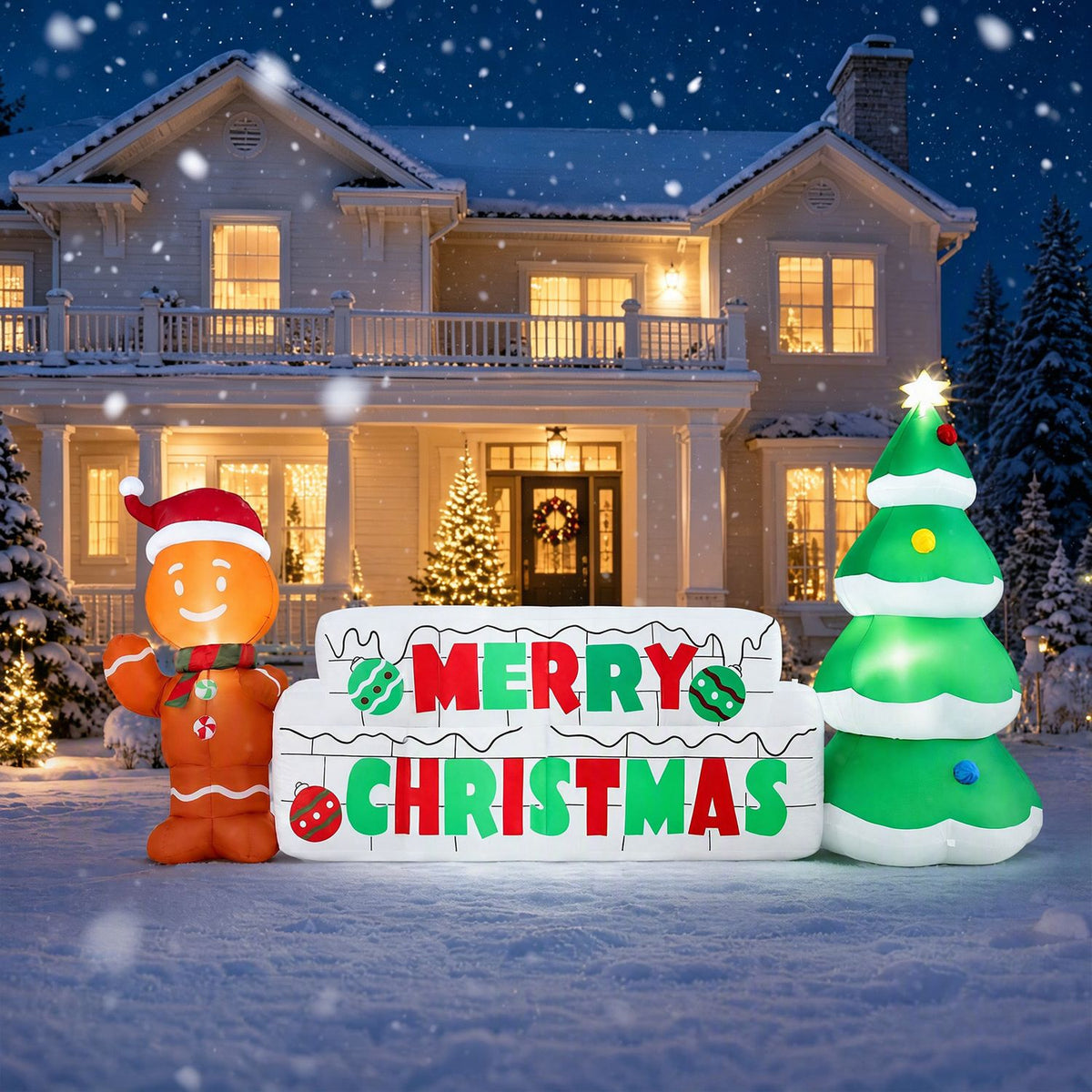 Inflatable holiday display in front of a snow-covered house, with a gingerbread figure, festive sign, and tree.