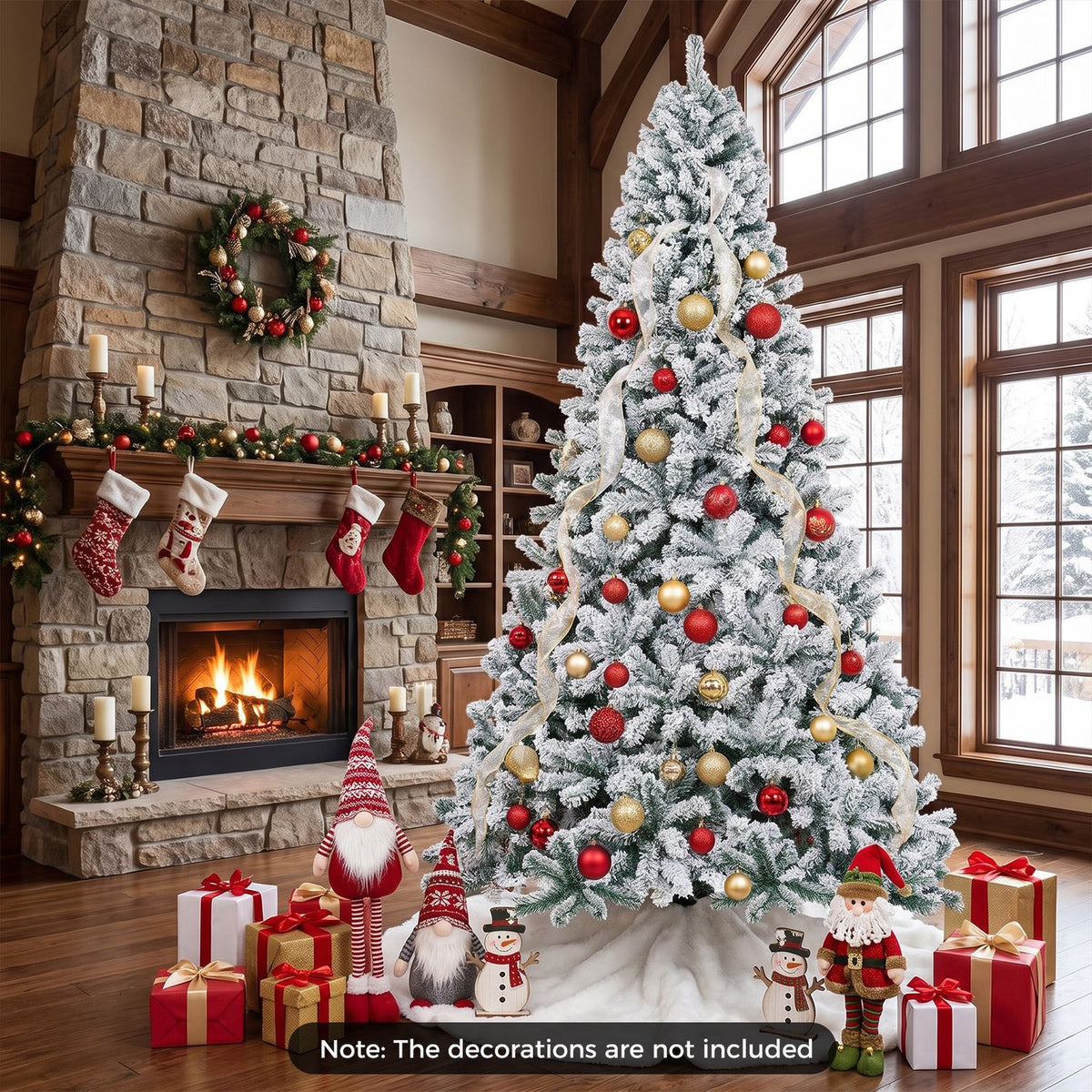 Snow-flocked tree decorated with red and gold ornaments beside a stone fireplace and wrapped presents.