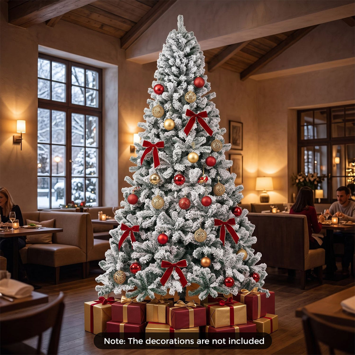Ornamented flocked Christmas tree with wrapped gifts in a warmly lit dining room.