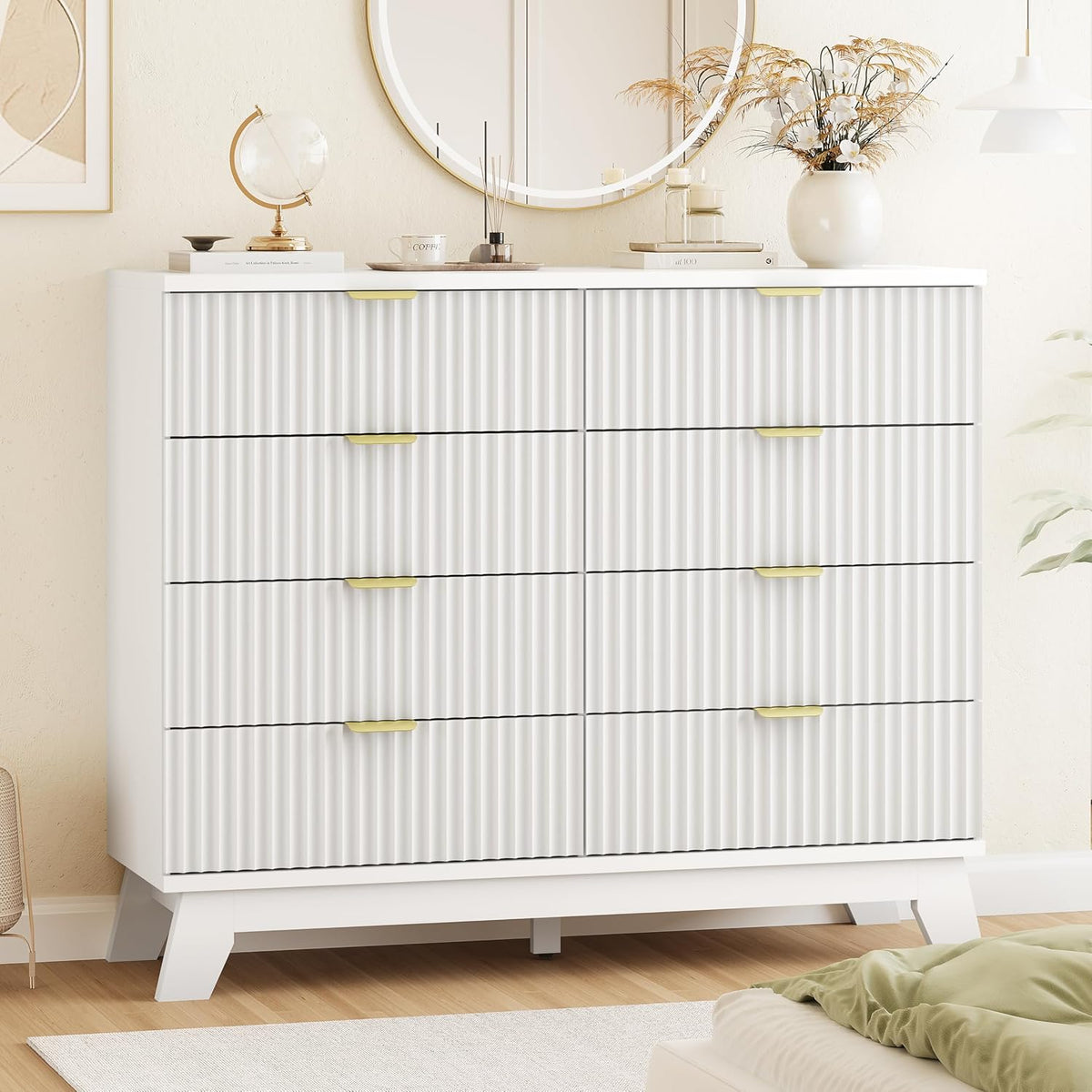 White wave-panel dresser shown with decorative top styling and gold handles