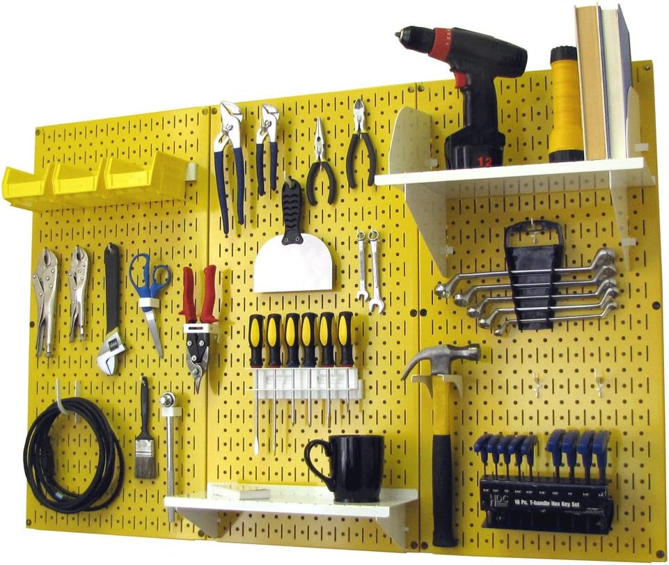 Yellow pegboard wall with shelves, bins and assorted tools neatly hung and displayed