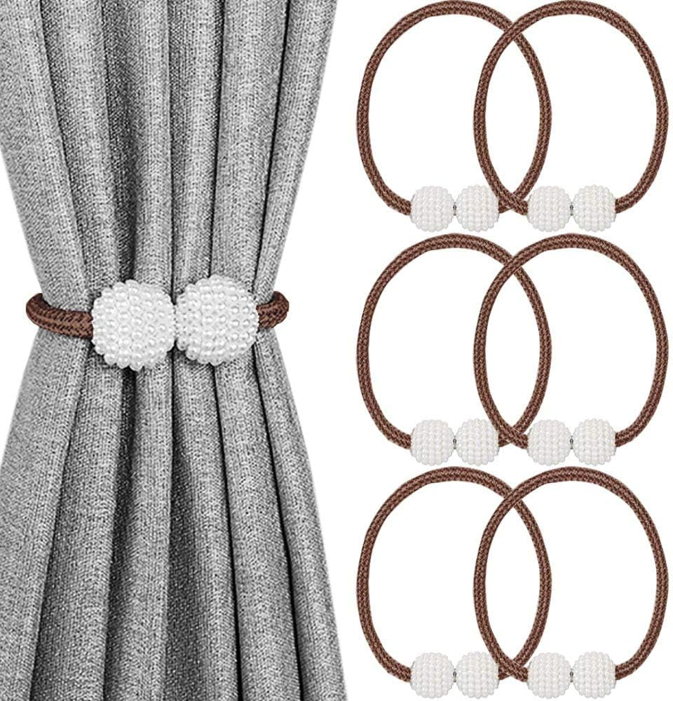 Curtain tied back with a brown braided magnetic loop and two white beaded balls, plus four matching loops shown to the right.
