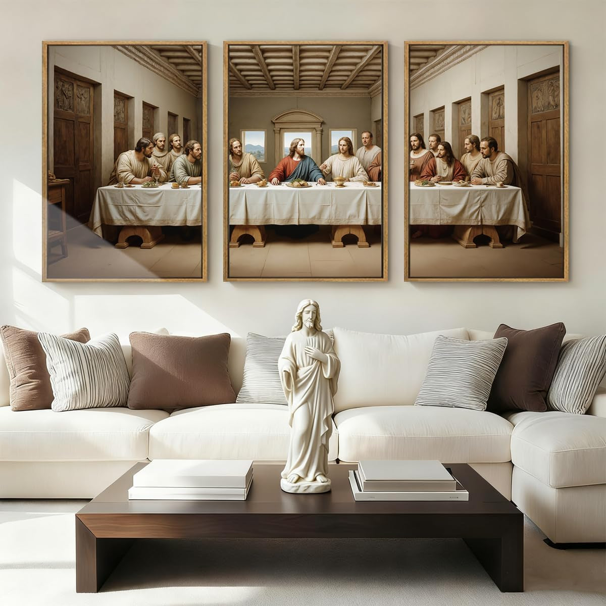 Living room with three framed Last Supper panels above a white sofa and a Jesus statue on a low coffee table.