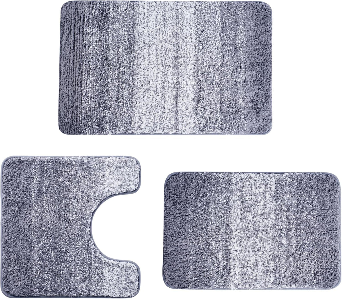 Three-piece bathroom rug set in gray and white gradient, including U-shaped toilet piece