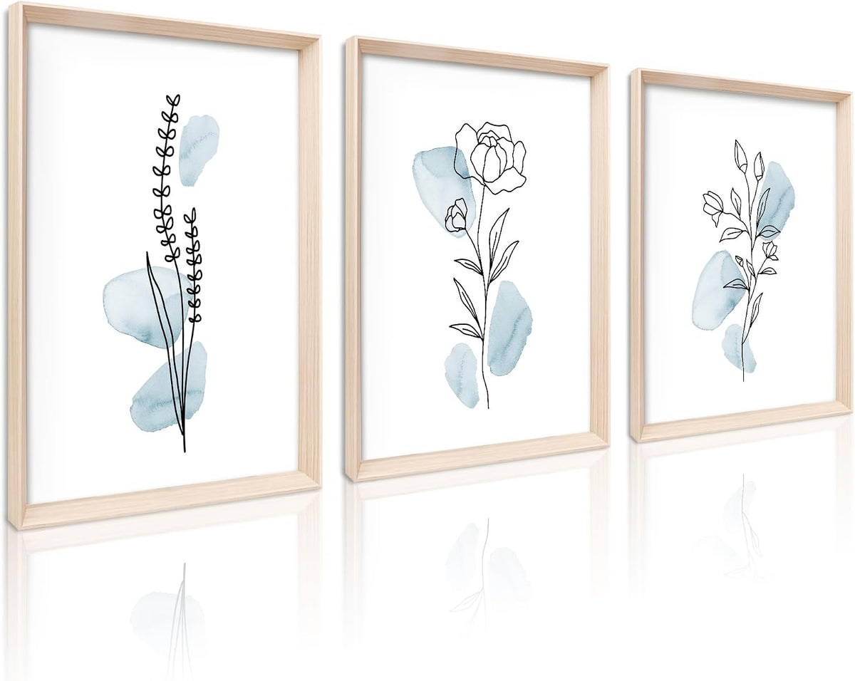 Three vertical framed botanical prints with sage watercolor shapes and thin black line drawings, reflected below