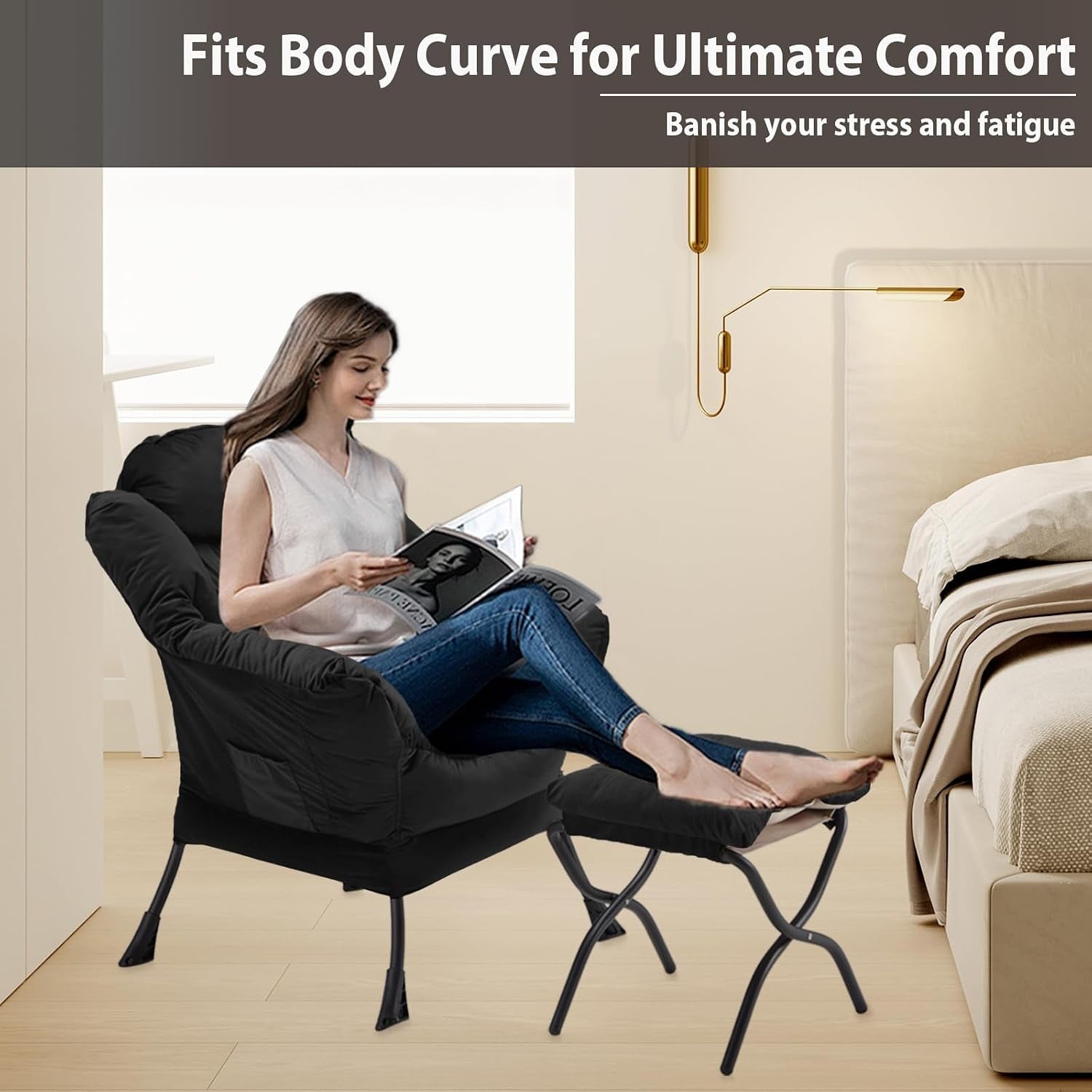 Woman reclining on the black velvet lazy chair with the foldable ottoman supporting her legs