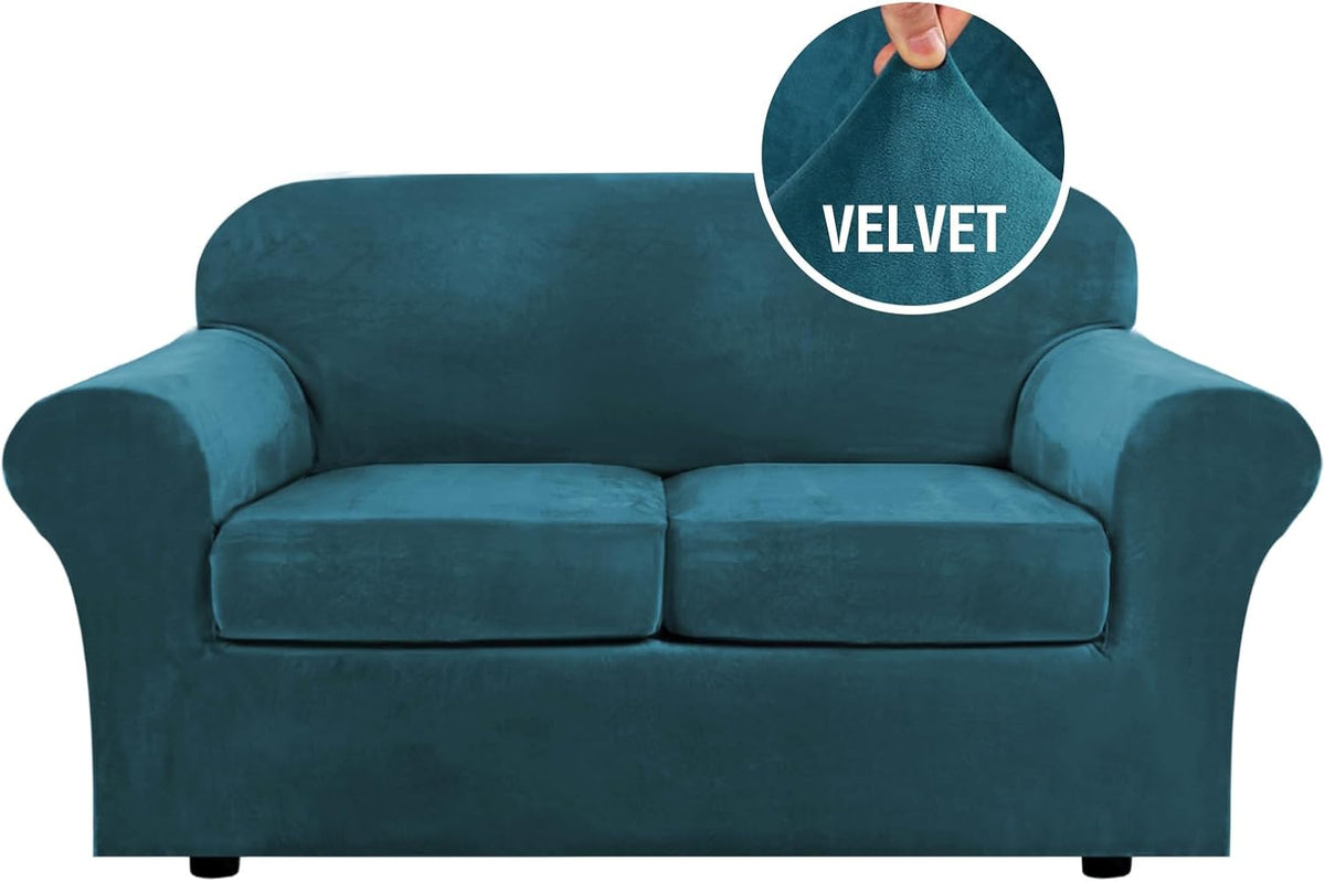Front-facing three-seat sofa in deep sapphire blue velvet with low black feet visible.
