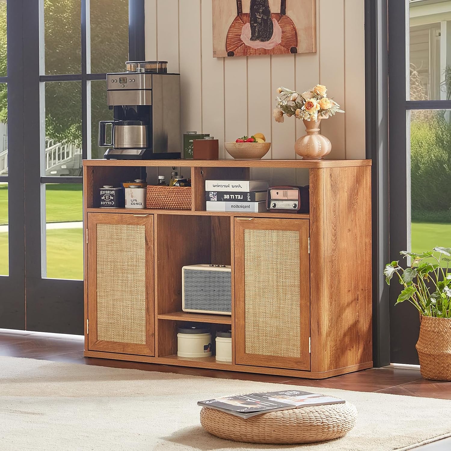 Tea-brown cabinet styled in a sunlit living room with coffee maker on top and open shelving visible