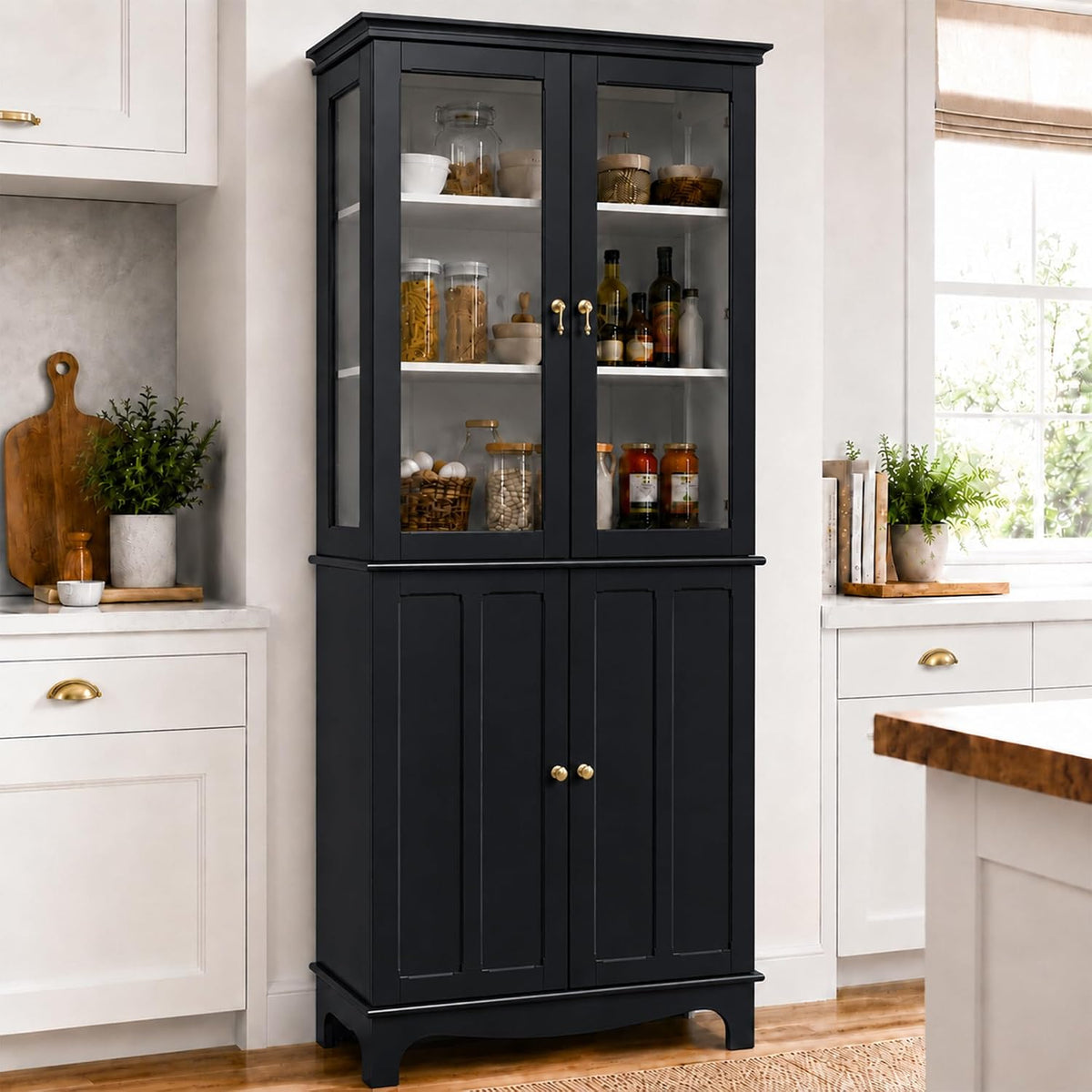 Black china cabinet placed between counters, showing glass doors and plated pantry items inside