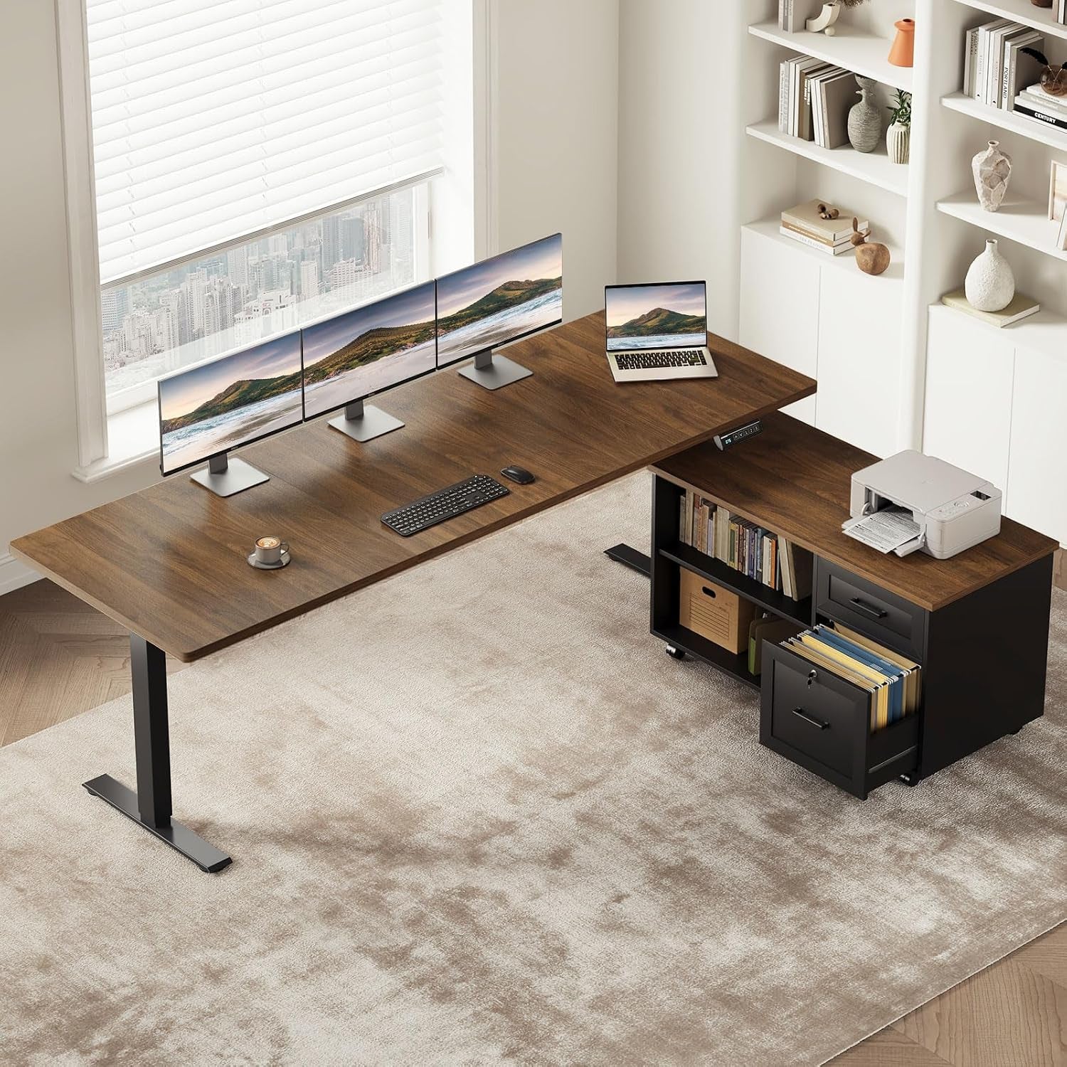 Angled view of walnut L-shaped sit-stand desk with black storage cabinet and laptop on desktop