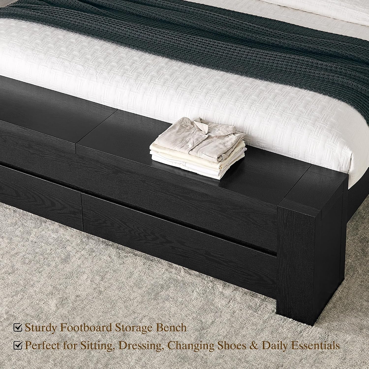 Top-close view of footboard bench surface in black showing drawer fronts and seating surface
