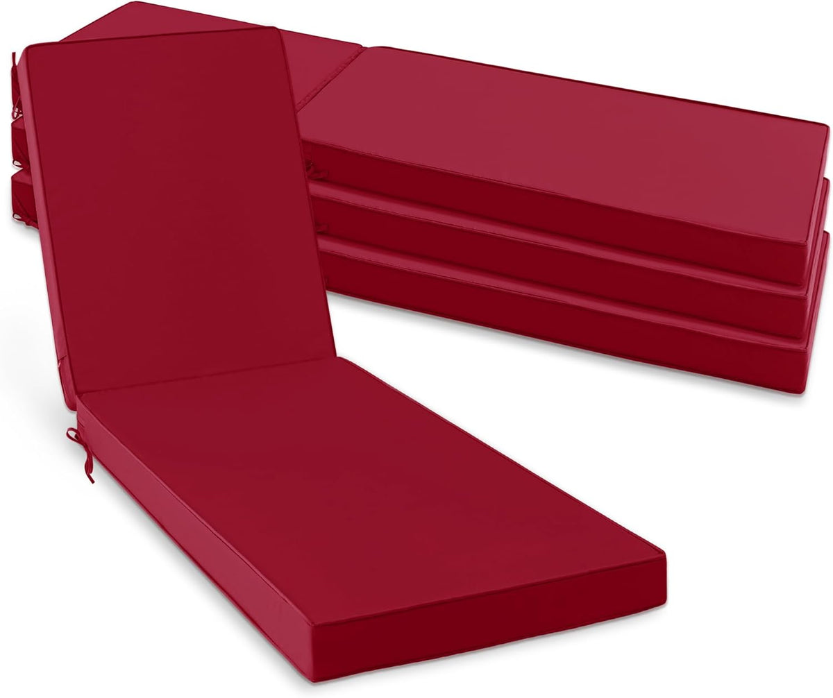 Stack of four red chaise lounge cushions with one cushion propped up, ties at the sides.