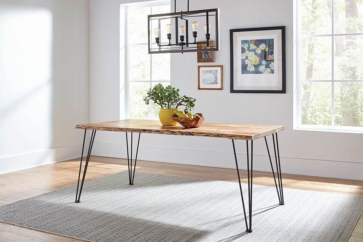 Live-edge acacia dining table in a bright dining room with pendant light and area rug
