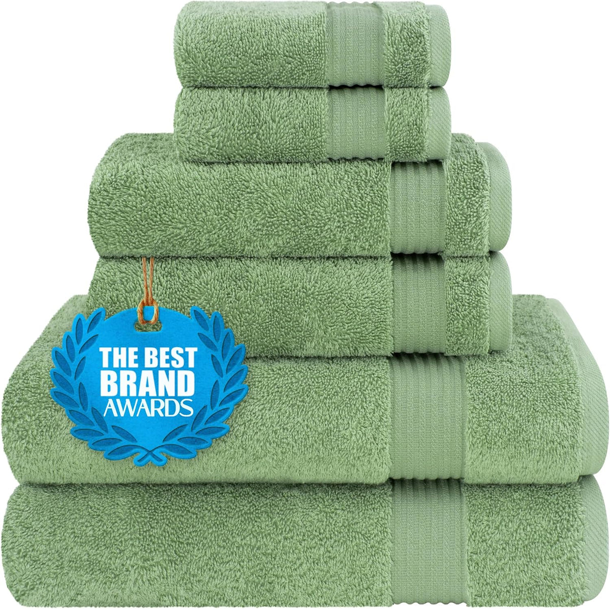 Stack of soft green towels photographed close up with a blue award tag hanging on front