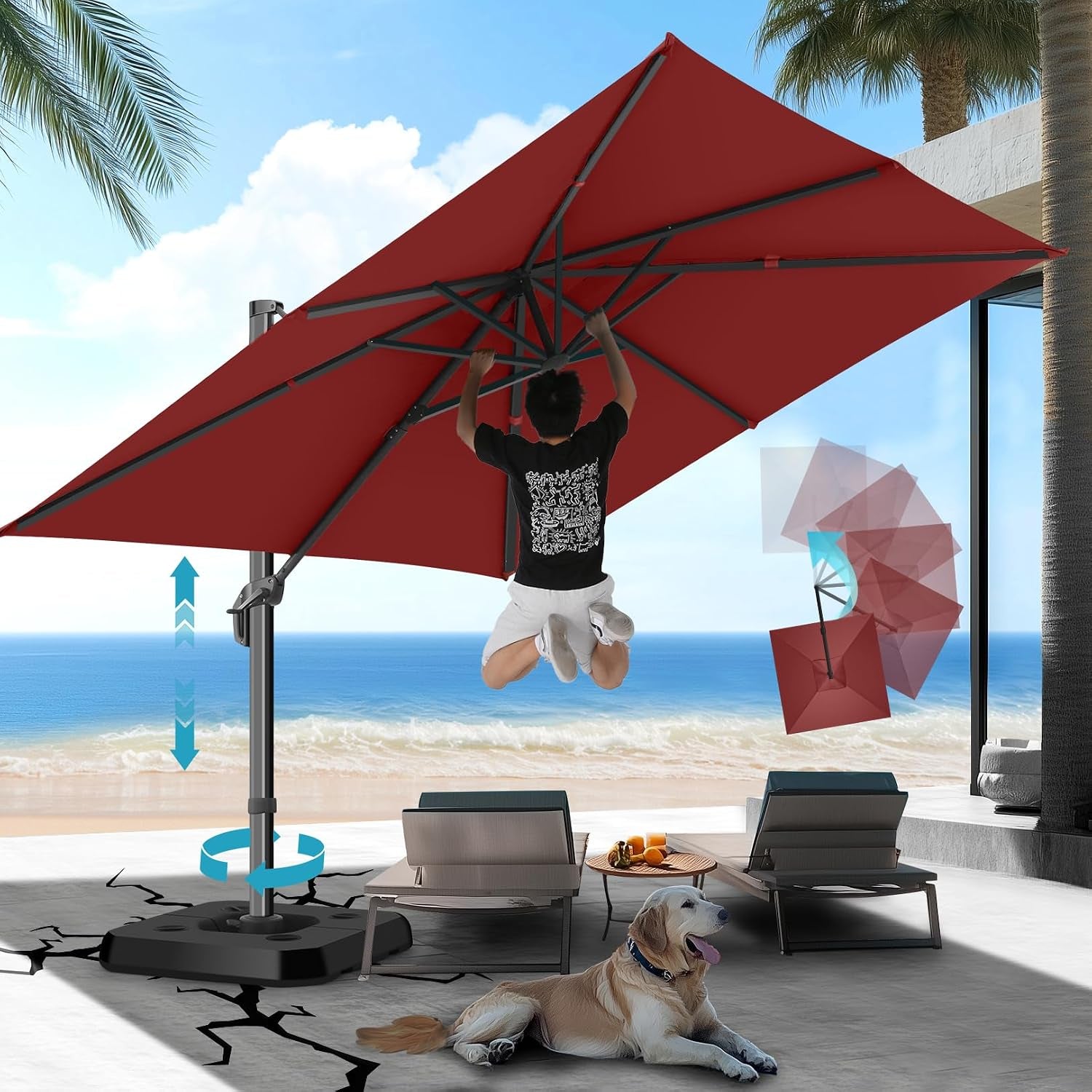 Red offset umbrella open on a beachfront patio with a person jumping beneath and a dog lying nearby