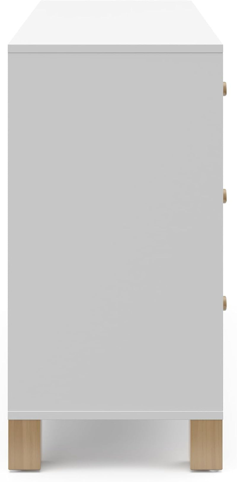 Side view of a white dresser showing driftwood square legs and three round side knobs.