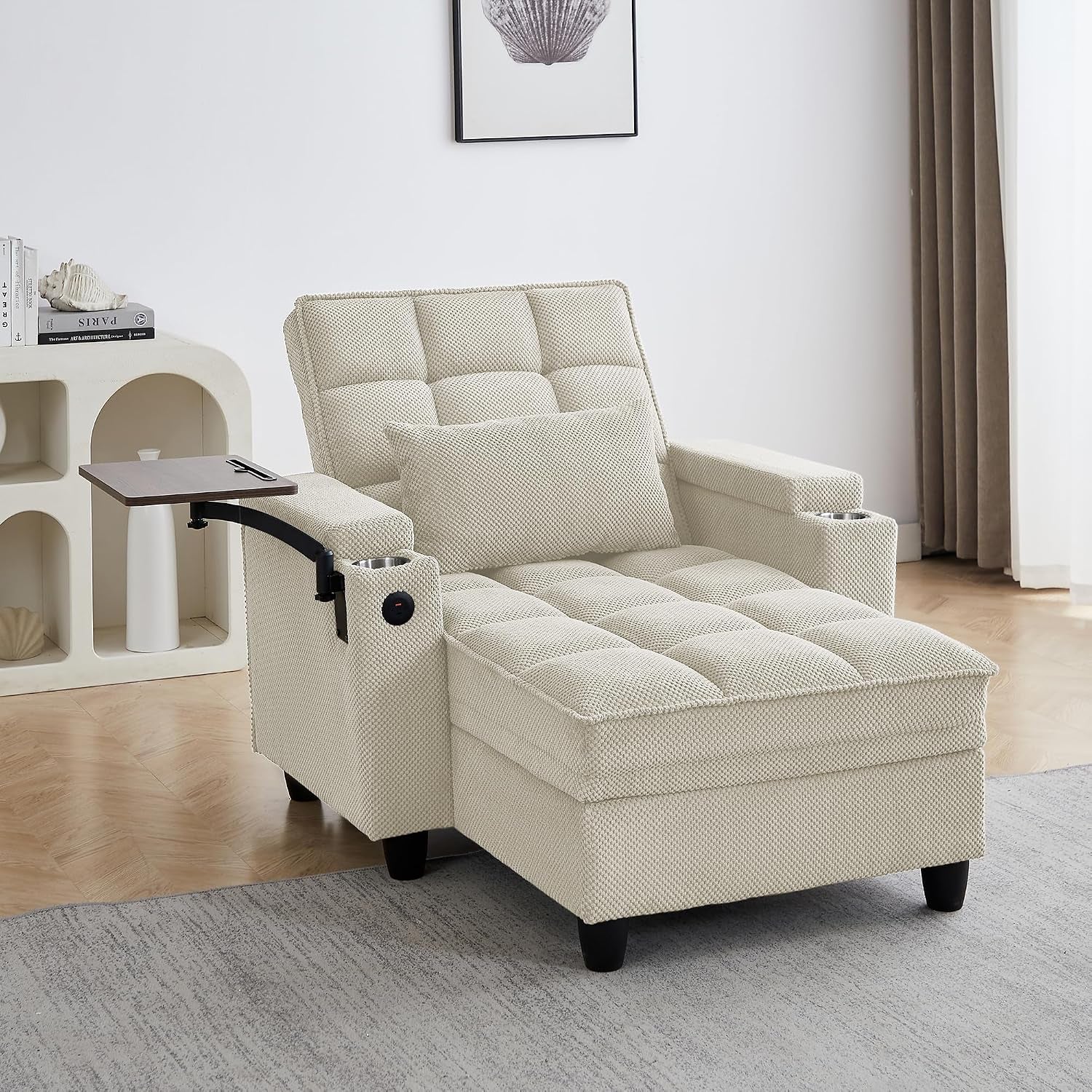 Cream-colored tufted chaise lounge in a living room with swivel tray extended and matching lumbar pillow.