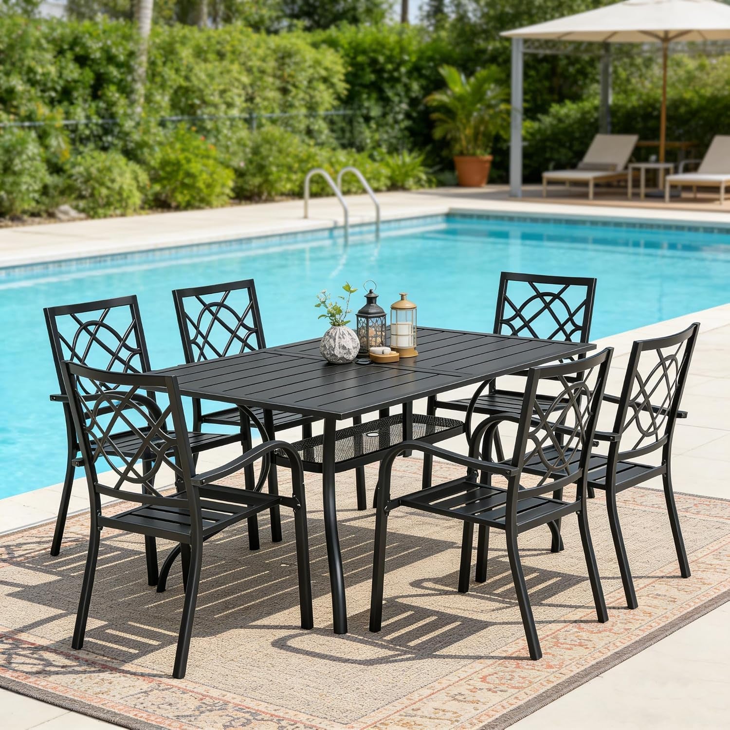 Rectangular black dining table with six chairs on a patterned rug beside a pool, three decorative lanterns centered on the
