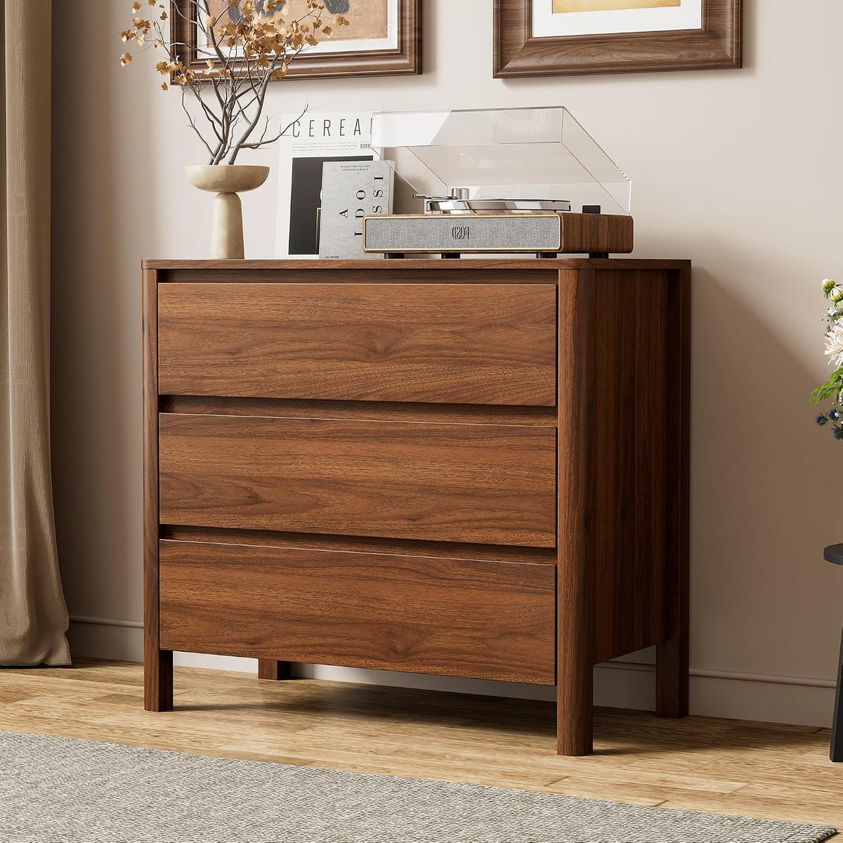 Close side view of the dresser top with decorative items and a record player on the walnut finish