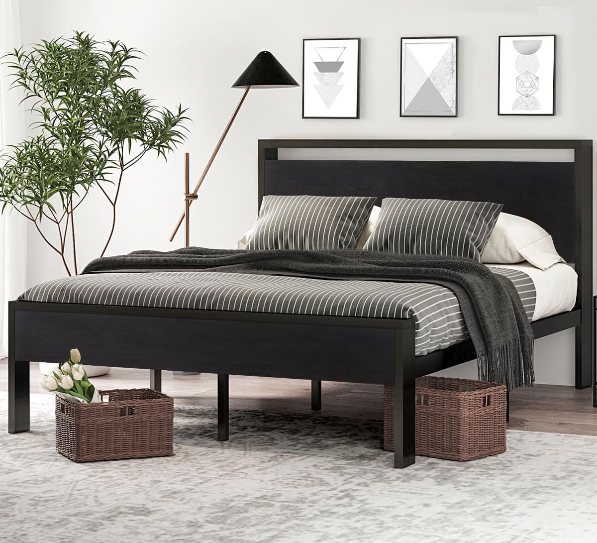 Same metal platform bed shown with a black-finish wooden headboard and footboard, striped bedding and woven baskets.