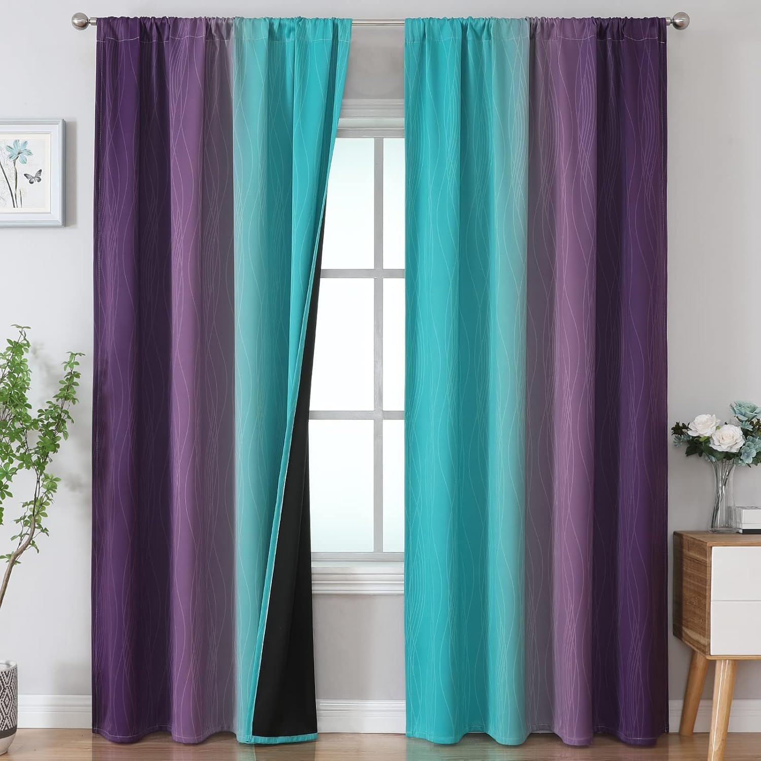 Window dressed with teal-to-purple ombre curtains featuring white wavy lines; center slightly parted to show black lining.
