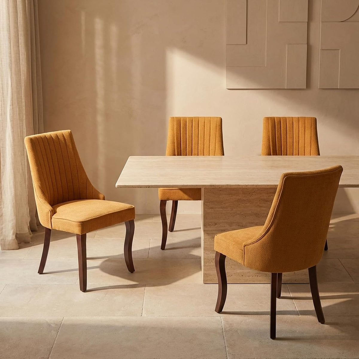 Four mustard-yellow upholstered dining chairs placed around a stone dining table in warm light.