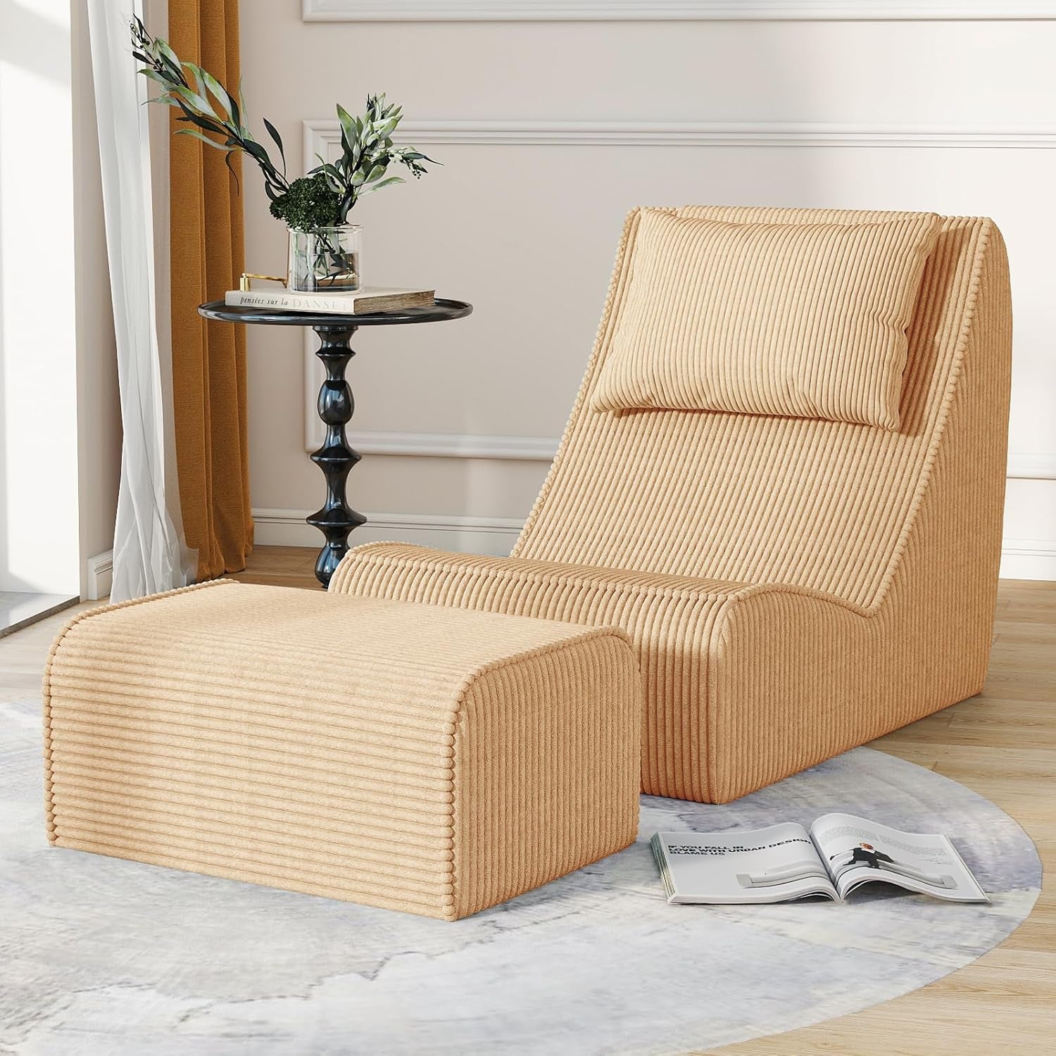 Beige ribbed chaise lounge and ottoman angled slightly left, placed near mustard curtains and a slender black side table.