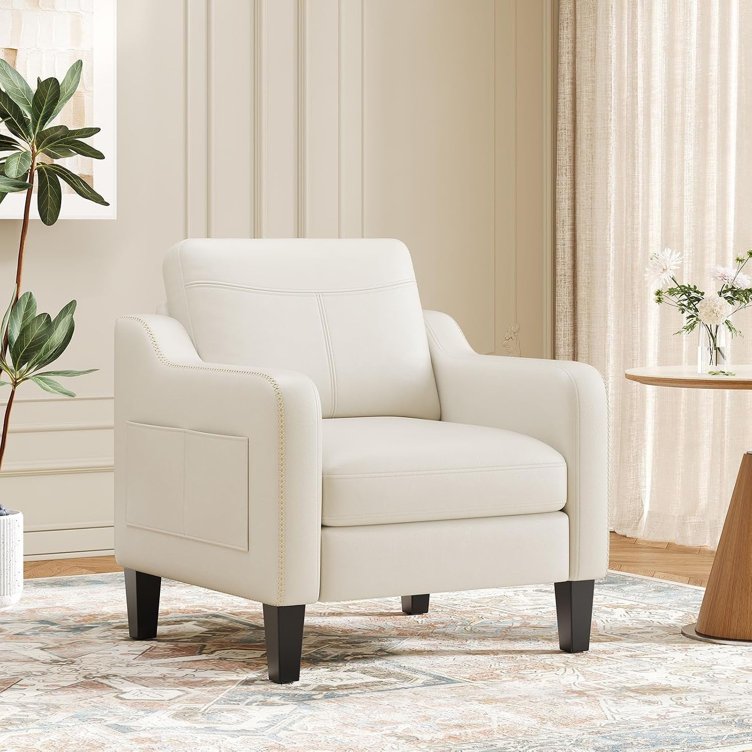 Cream-colored mid-century style armchair in a softly lit living room scene