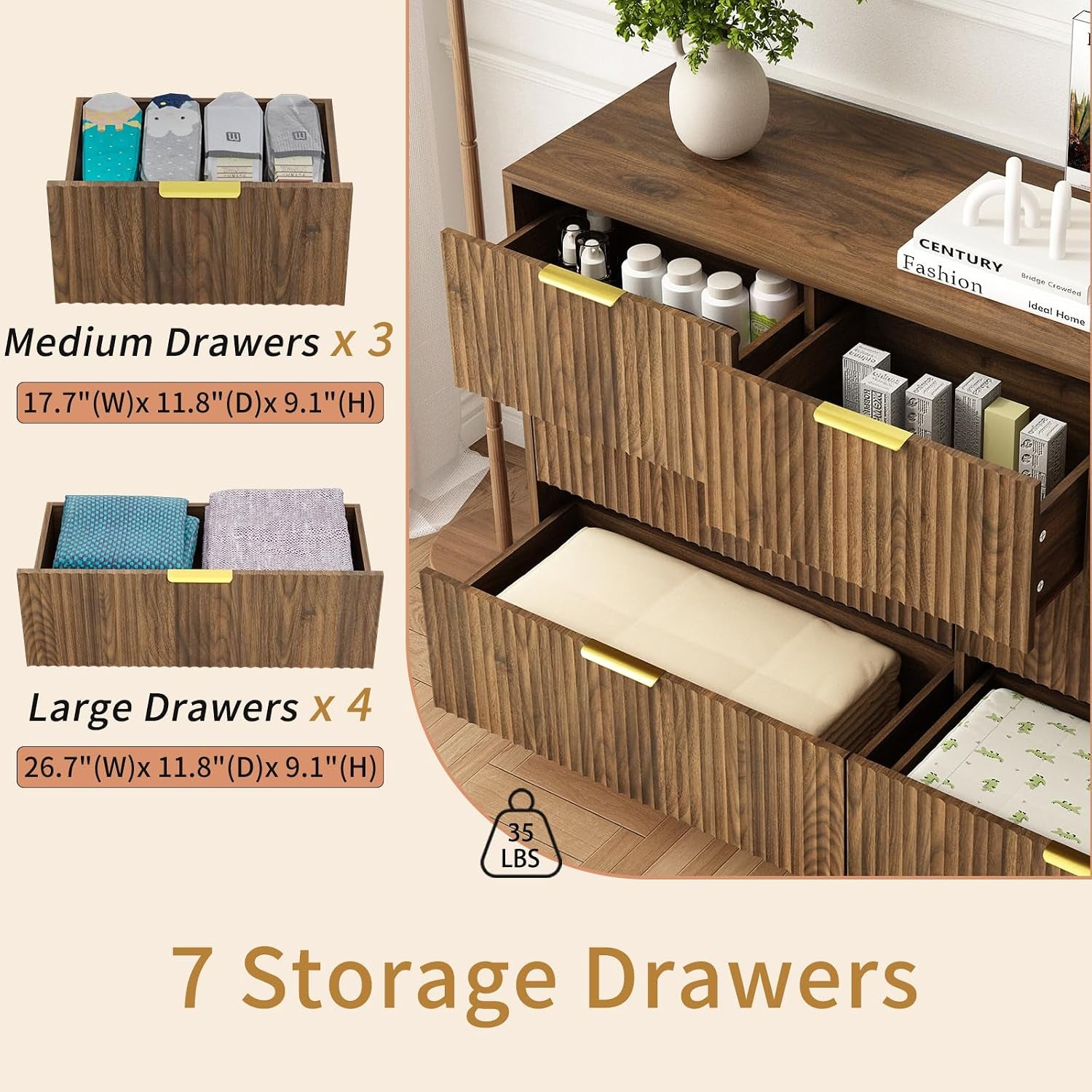 Close-up of open drawers showing fluted fronts, gold handles and interior storage with folded linens and items