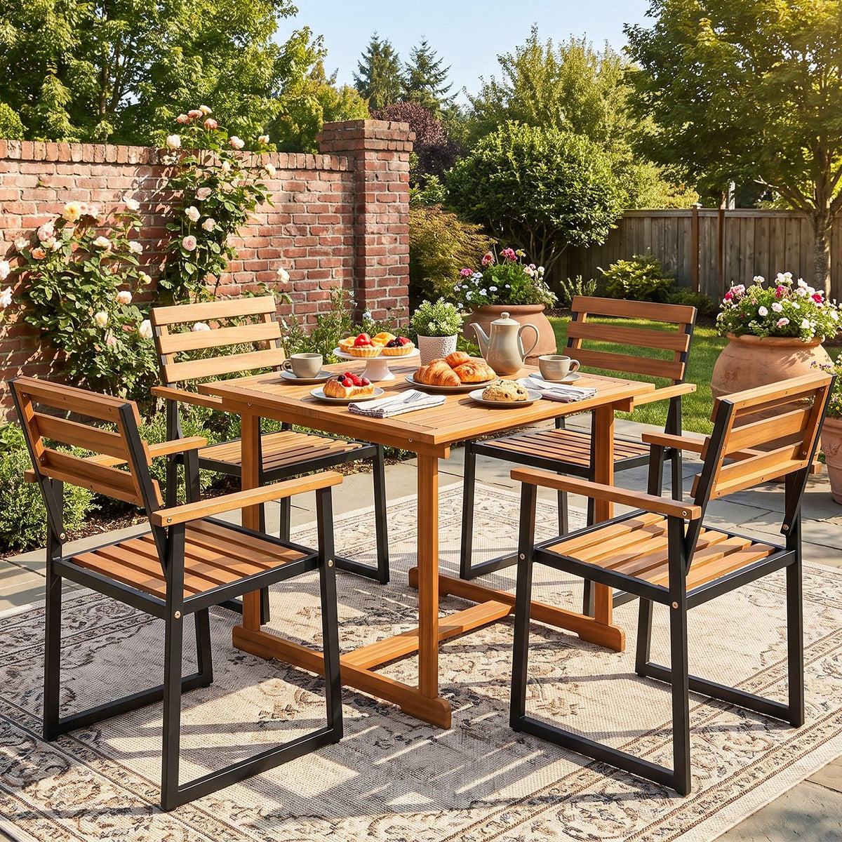 Acacia-tone slatted dining chairs with black frames around a table on a garden patio