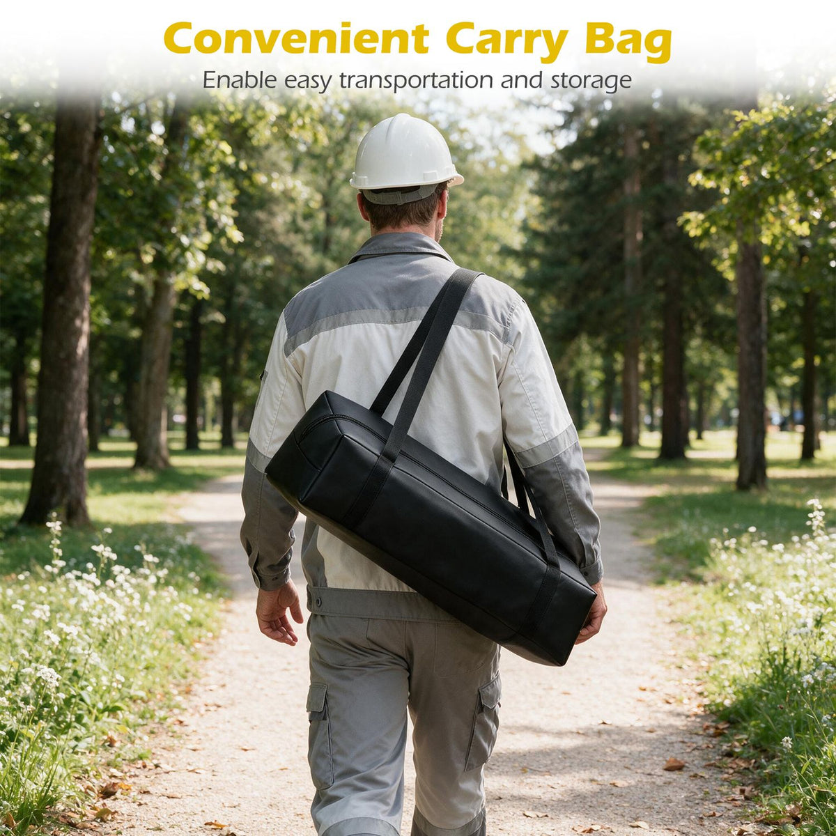 A worker walks along a wooded path carrying a long black shoulder bag.