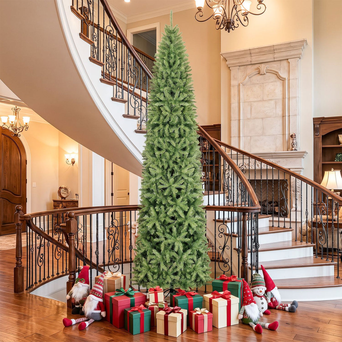 Tall, undecorated green Christmas tree beside a sweeping staircase, with wrapped presents at its base.