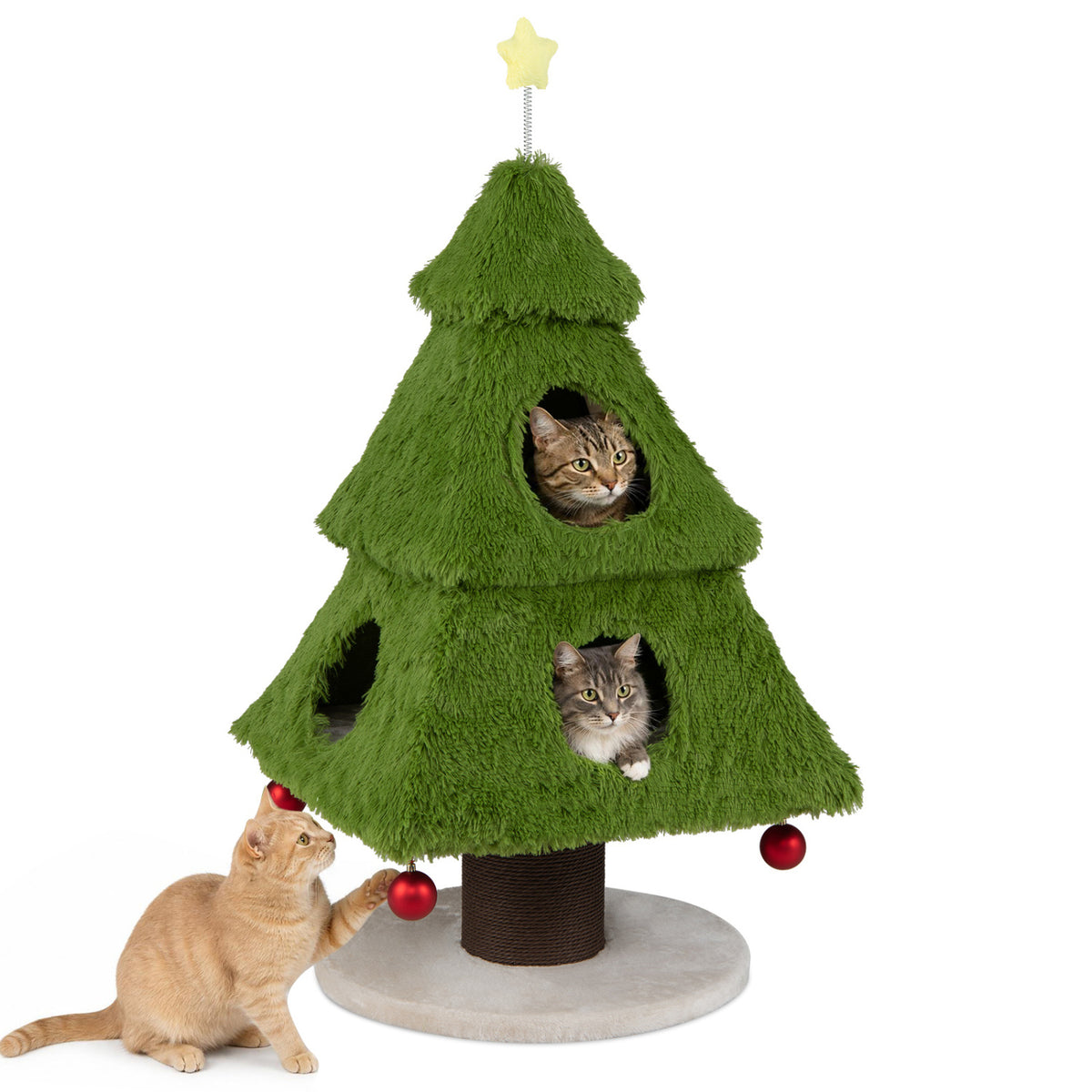 Three cats gather around a green tree-shaped cat tower, with two peeking through its openings.