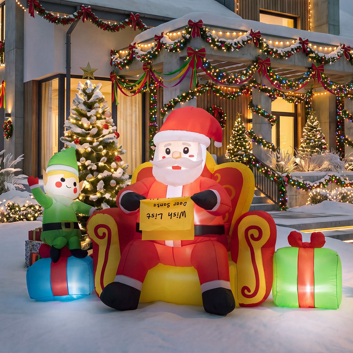 Inflatable Santa sits in a red-and-gold chair beside an elf and wrapped gifts, beneath festive lights.