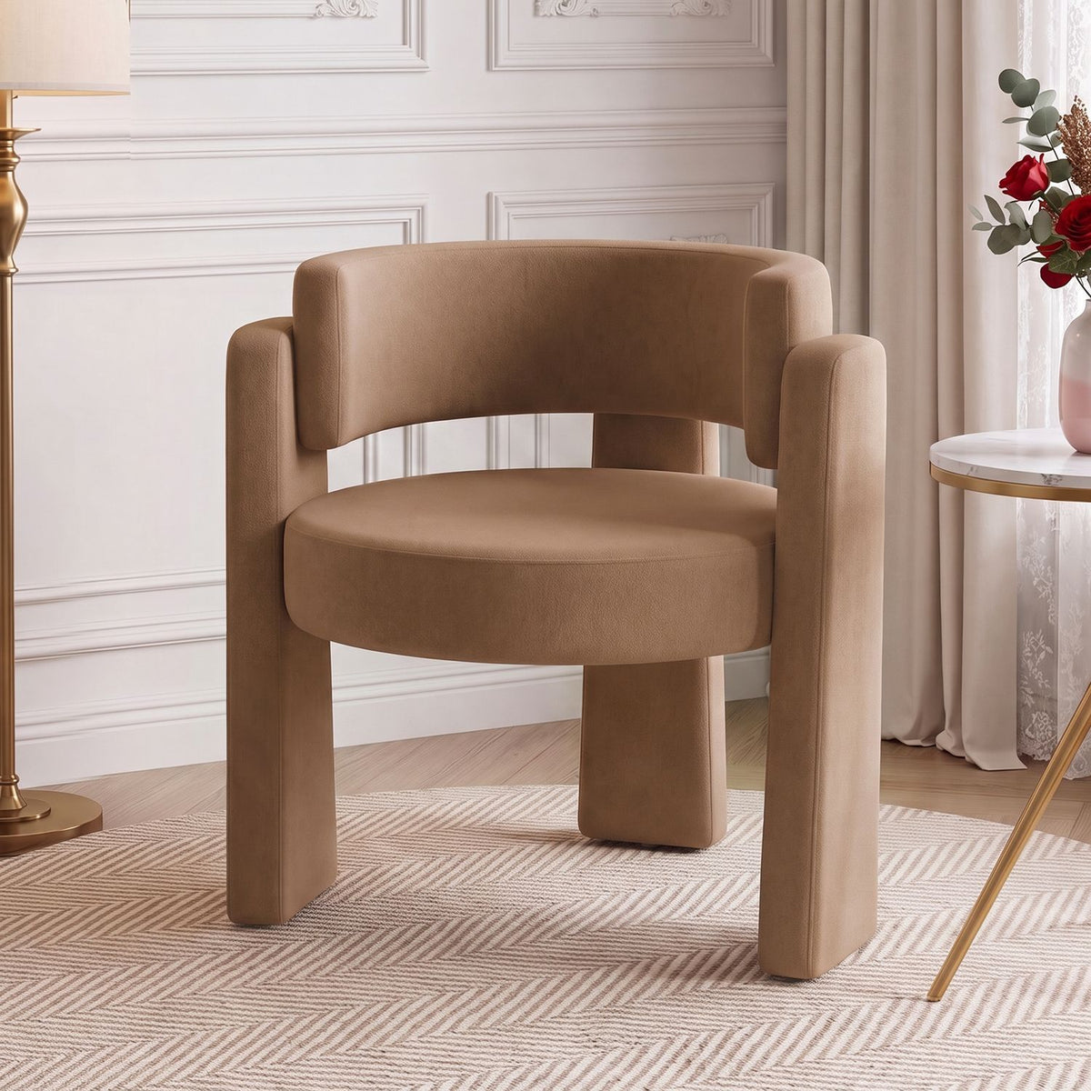 Tan velvet barrel chair with curved back, shown from the front in a bright living room