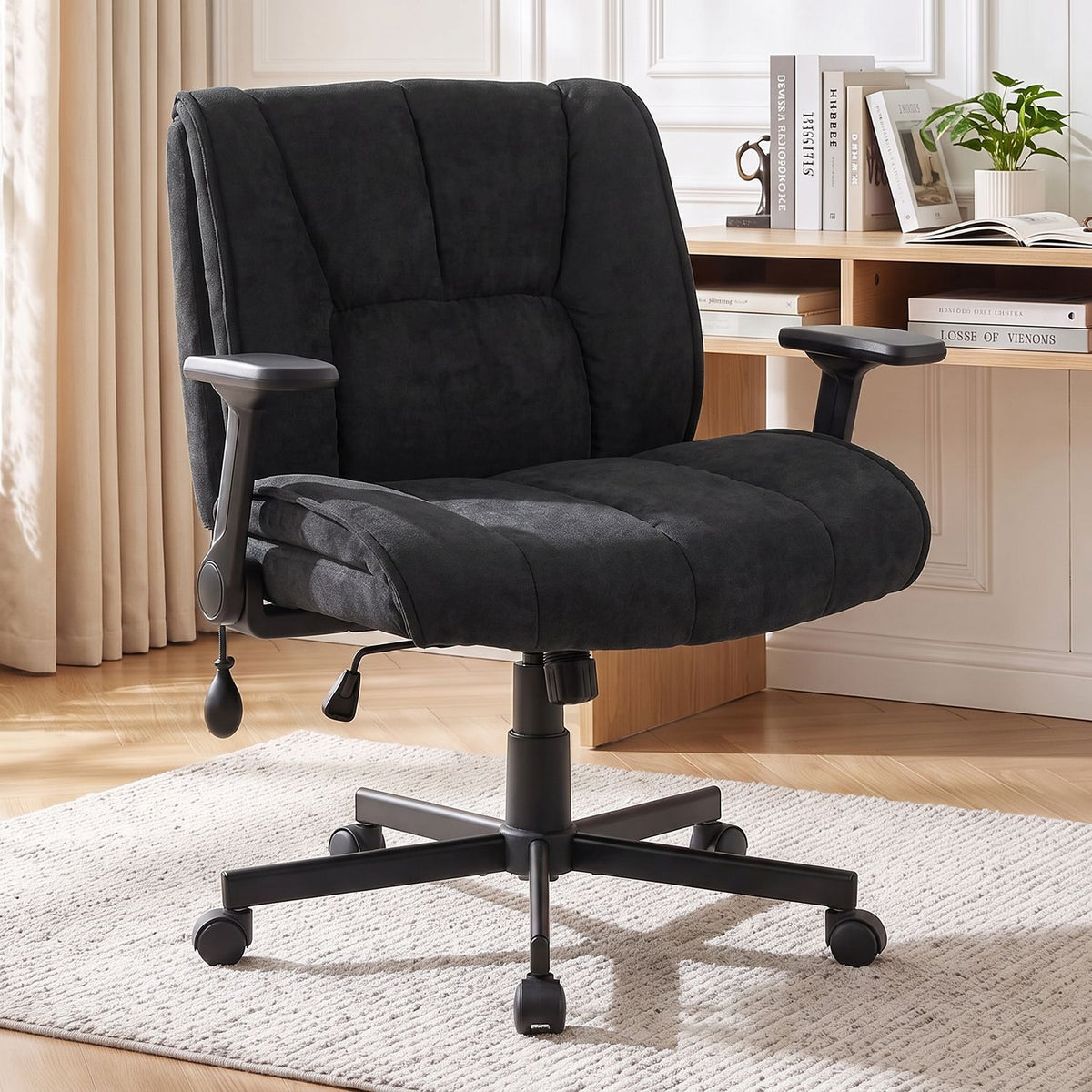 Black chenille office chair angled front view in a bright home office