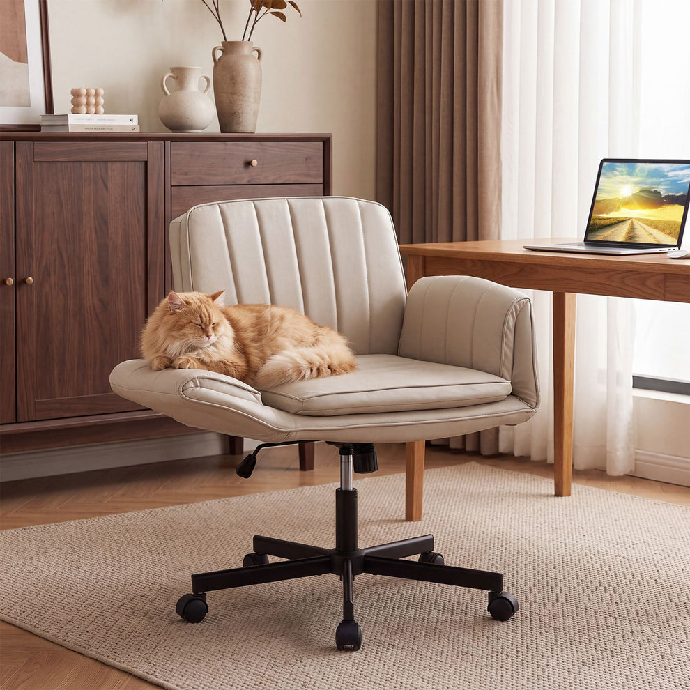 Beige criss-cross office chair with a cat on the seat beside a desk