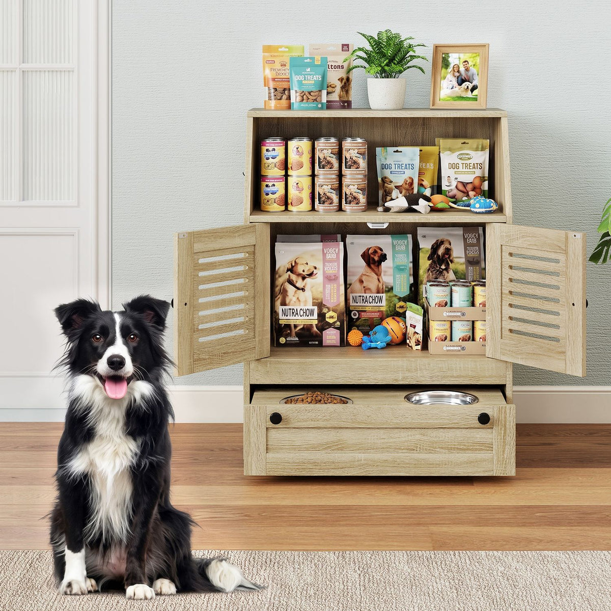 A dog sits beside the cabinet with its doors open, showing stored pet supplies and two bowls in the pulled-out drawer.