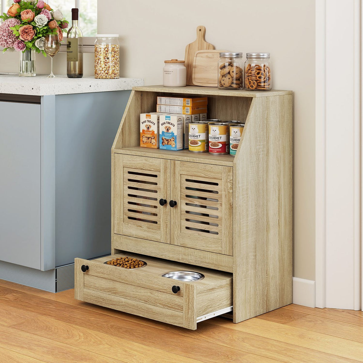 Wood-look feeding station beside a kitchen counter, with cabinet doors closed and the bowl tray pulled out.
