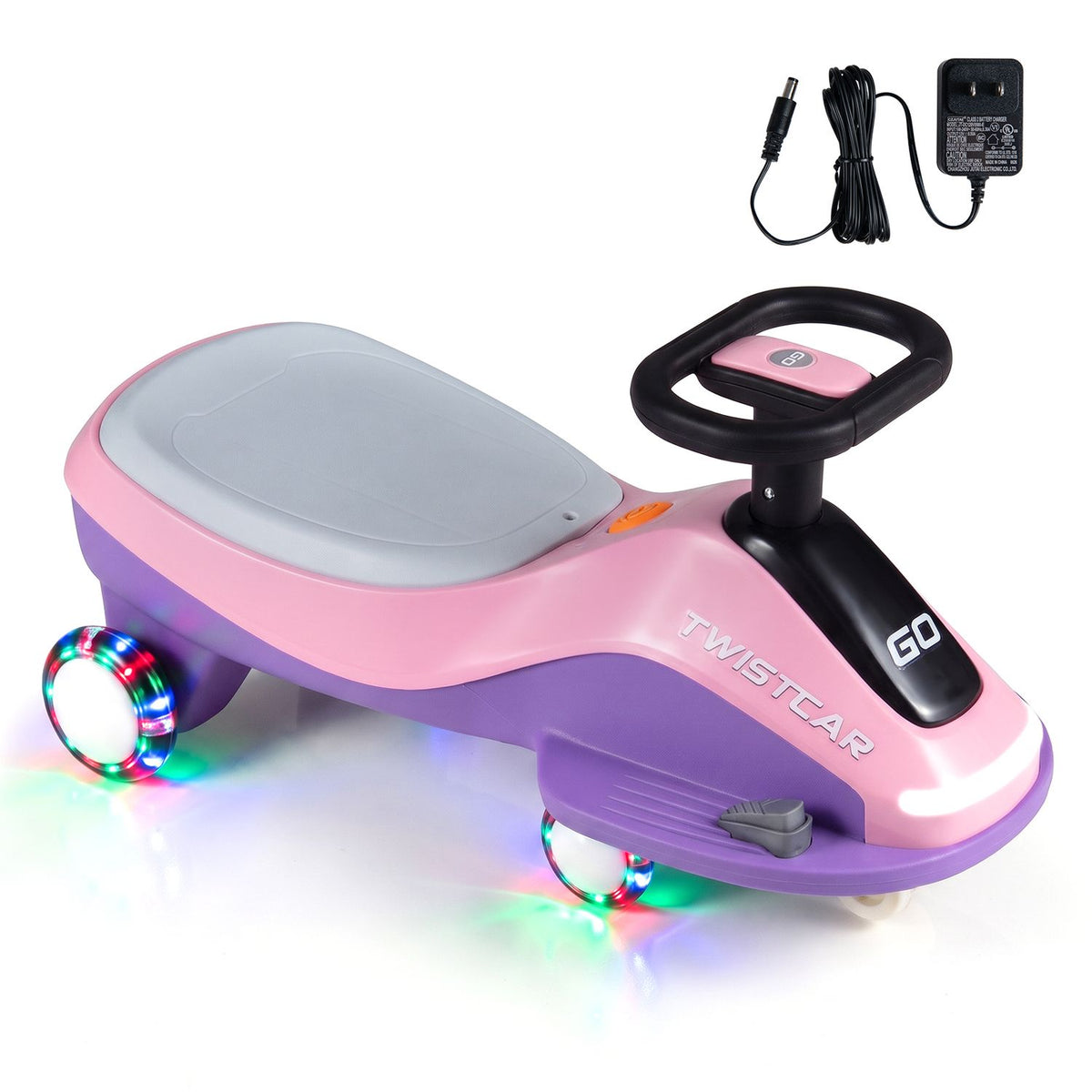 Pink-and-purple ride-on car shown at an angle with a power adapter and cable above it.