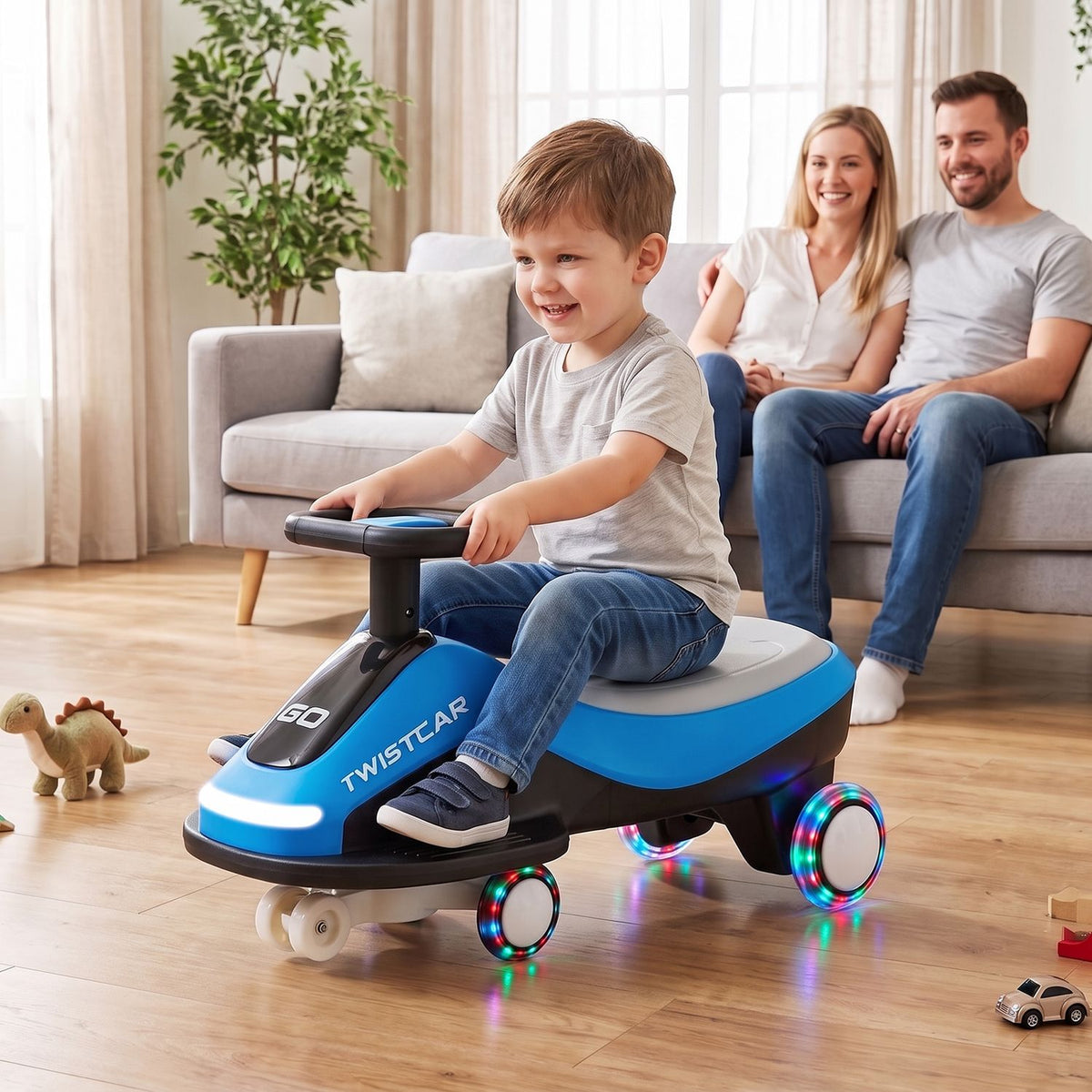 A child rides a blue and black wiggle car with illuminated wheels and a bright front light in a living room.