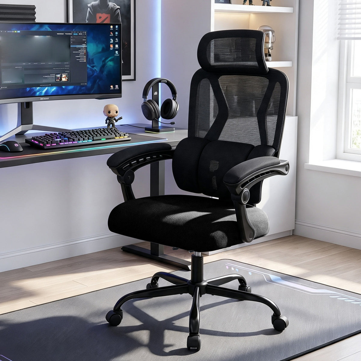 Black mesh office chair with padded seat and headrest beside a computer workstation.