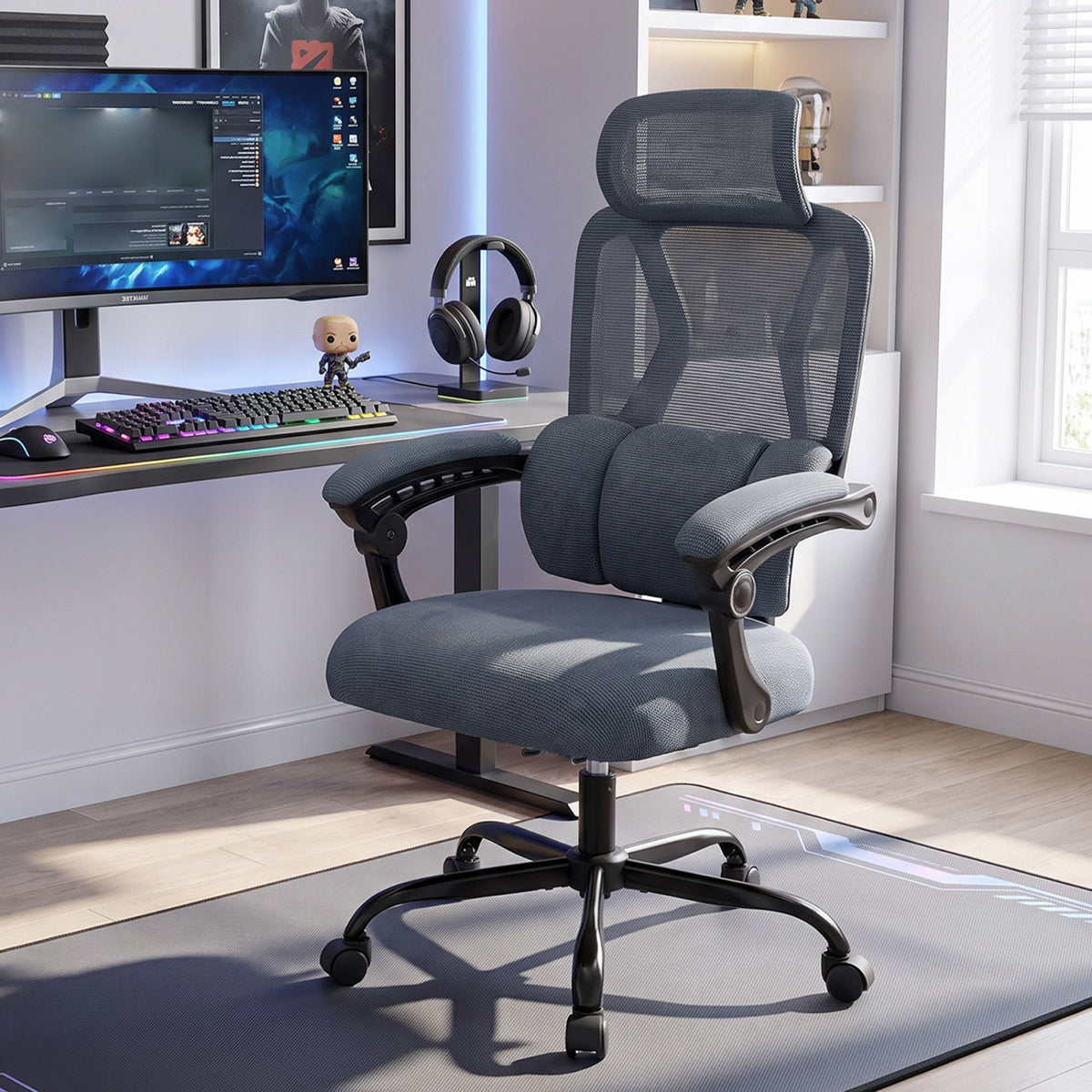 Dark gray mesh office chair facing forward beside a computer setup.