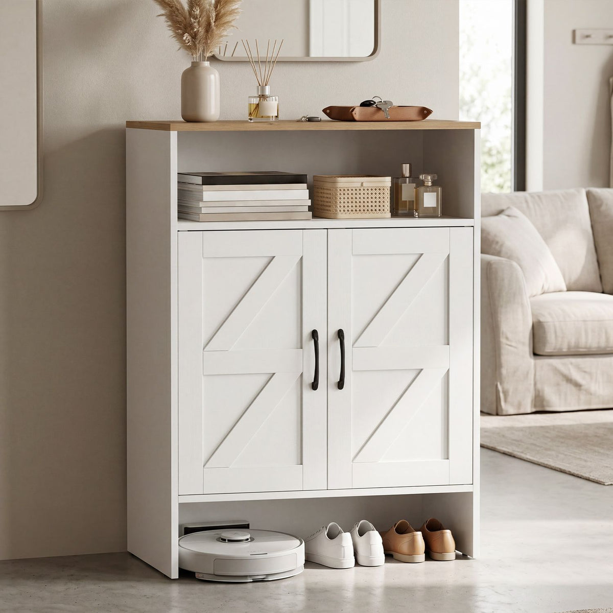 White shoe cabinet with a wood-look top, open shelf, two barn-style doors, and shoes displayed below.
