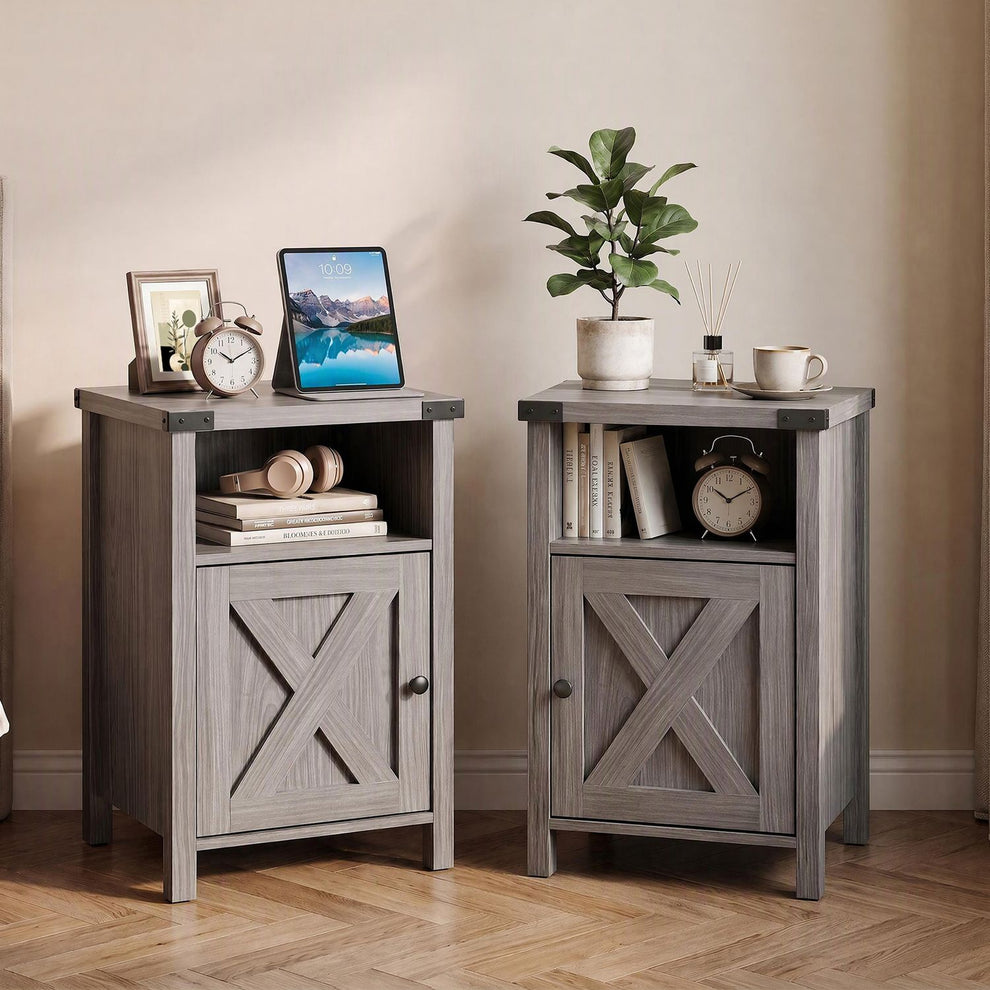 Two gray nightstands with barn-style doors and open shelves, styled beside a wall.