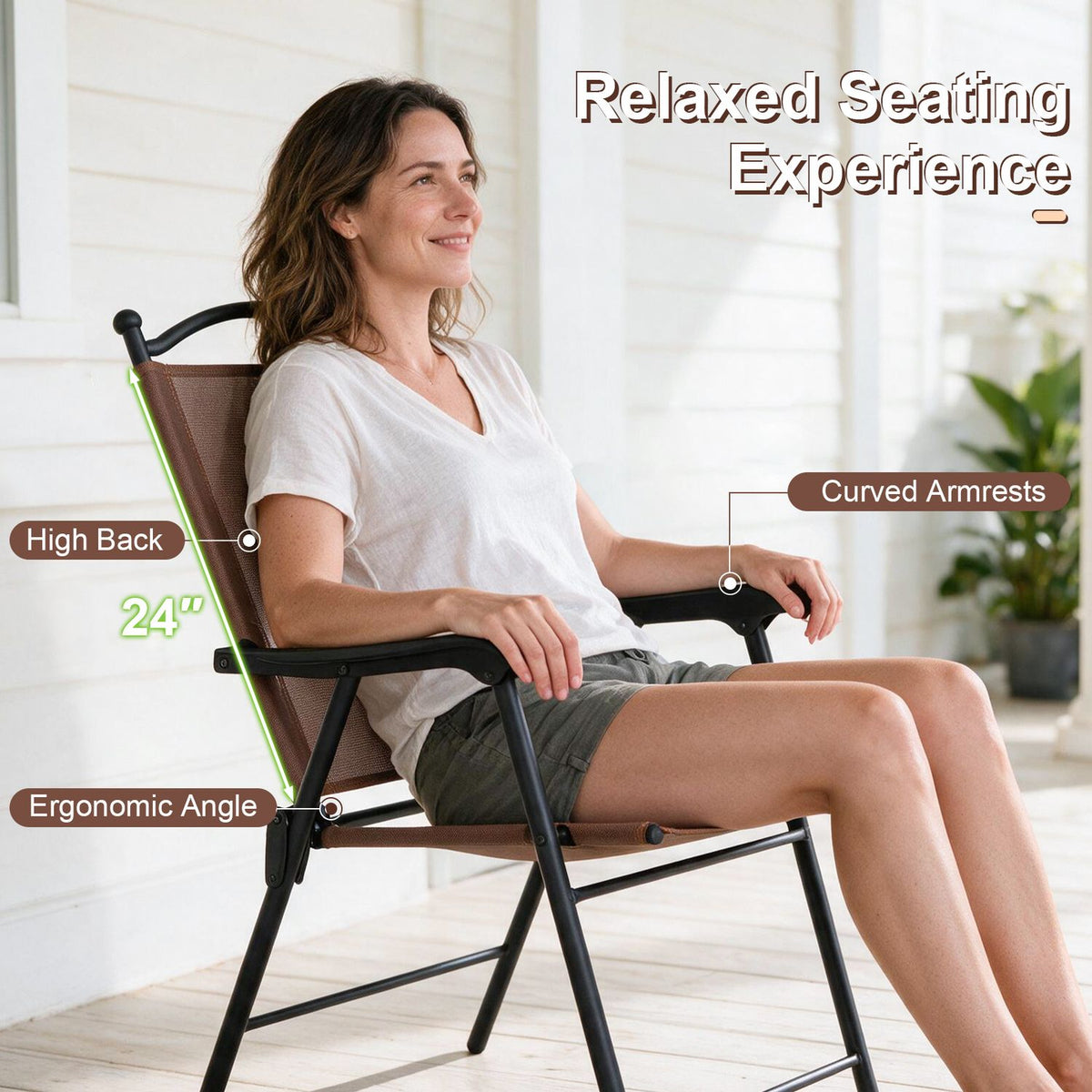 A woman relaxes in a brown fabric folding chair with black frame and curved armrests on a porch.